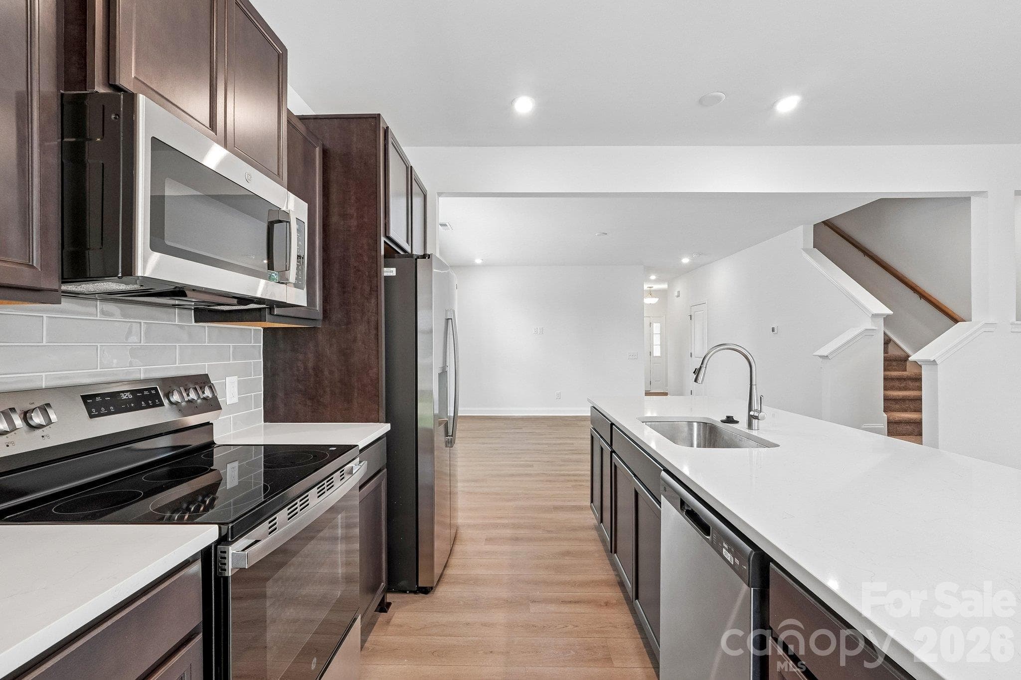 Stylish kitchen with stainless steel appliances. - Bell Glen, Charlotte