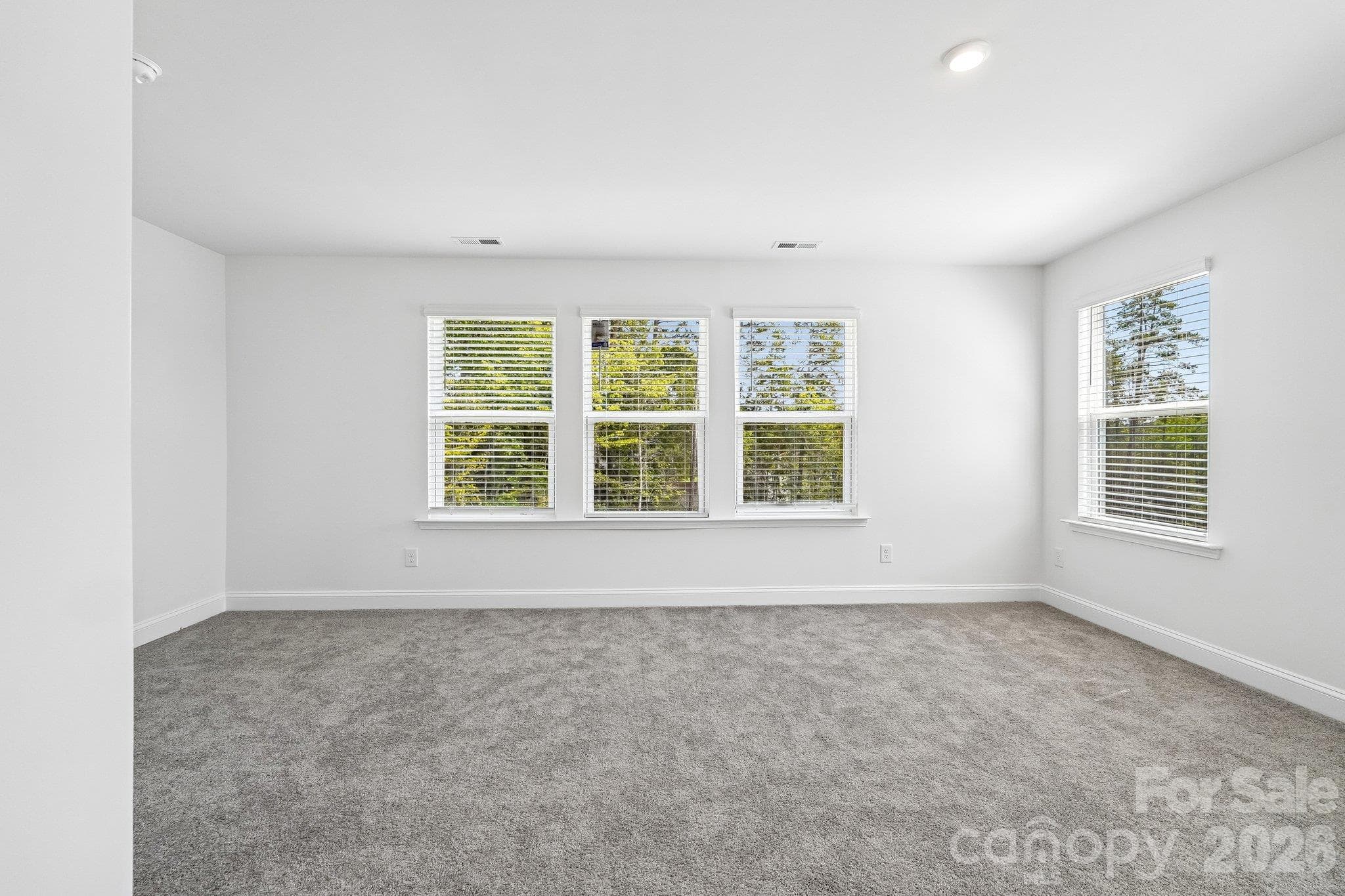 Spacious bedroom filled with natural light. - Bell Glen, Charlotte