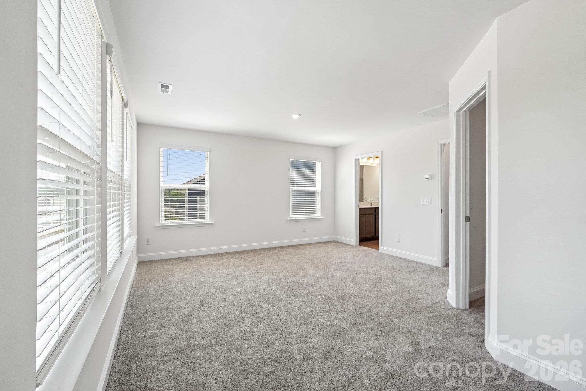 Another view highlights the bedroom’s generous layout. - Bell Glen, Charlotte