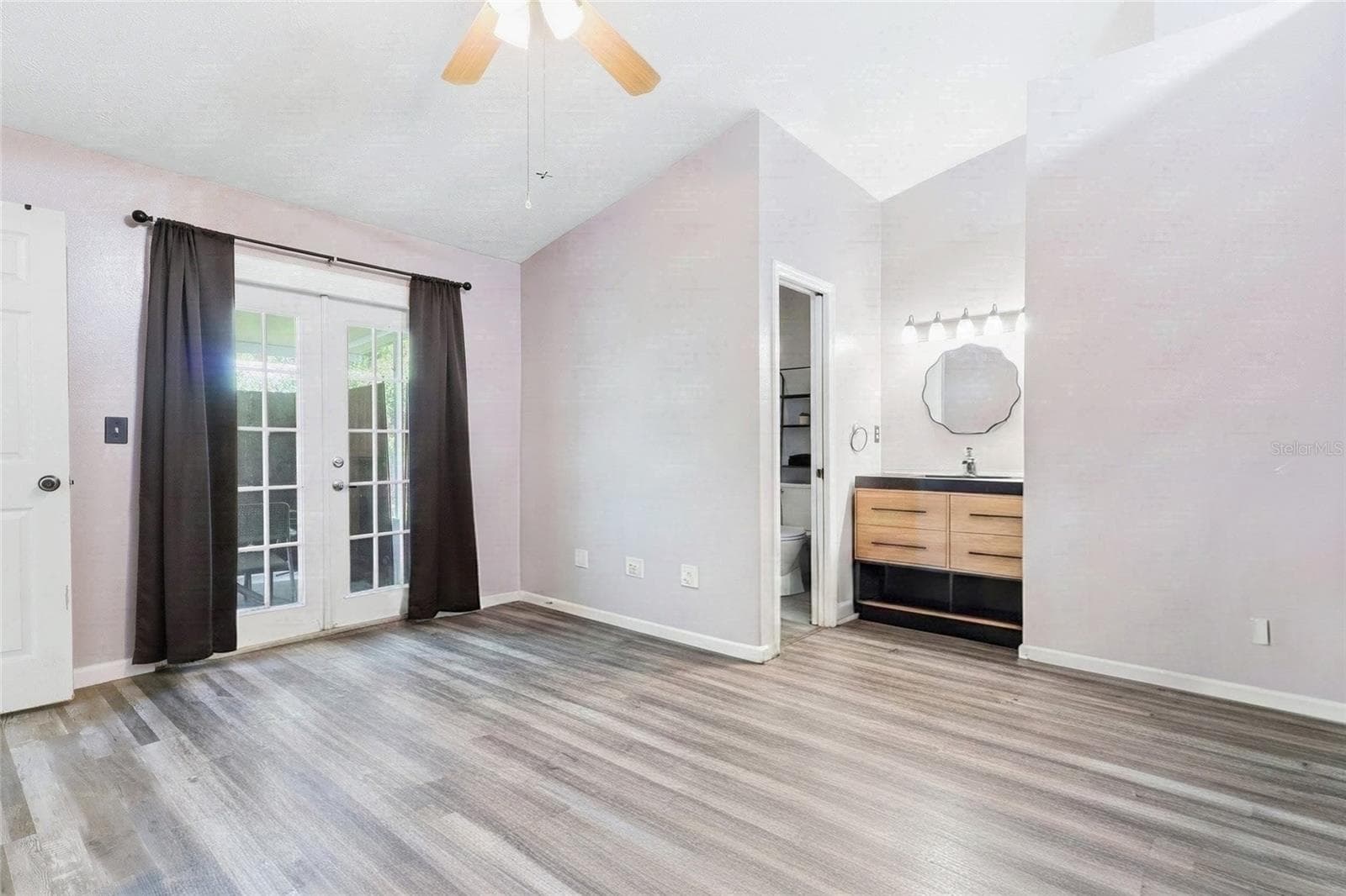 Primary Bedroom with French doors to lanai - 1405 E FRANCES AVE, PLANT CITY