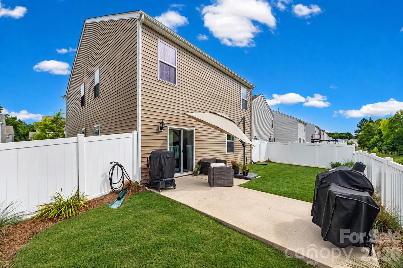 Fenced backyard with extended patio - 457 Misty Law Lane, Clover