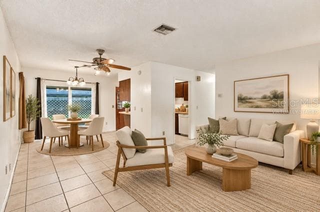 Virtually staged Living/ Dining Room - 711 THISTLE PL, WINTER SPRINGS