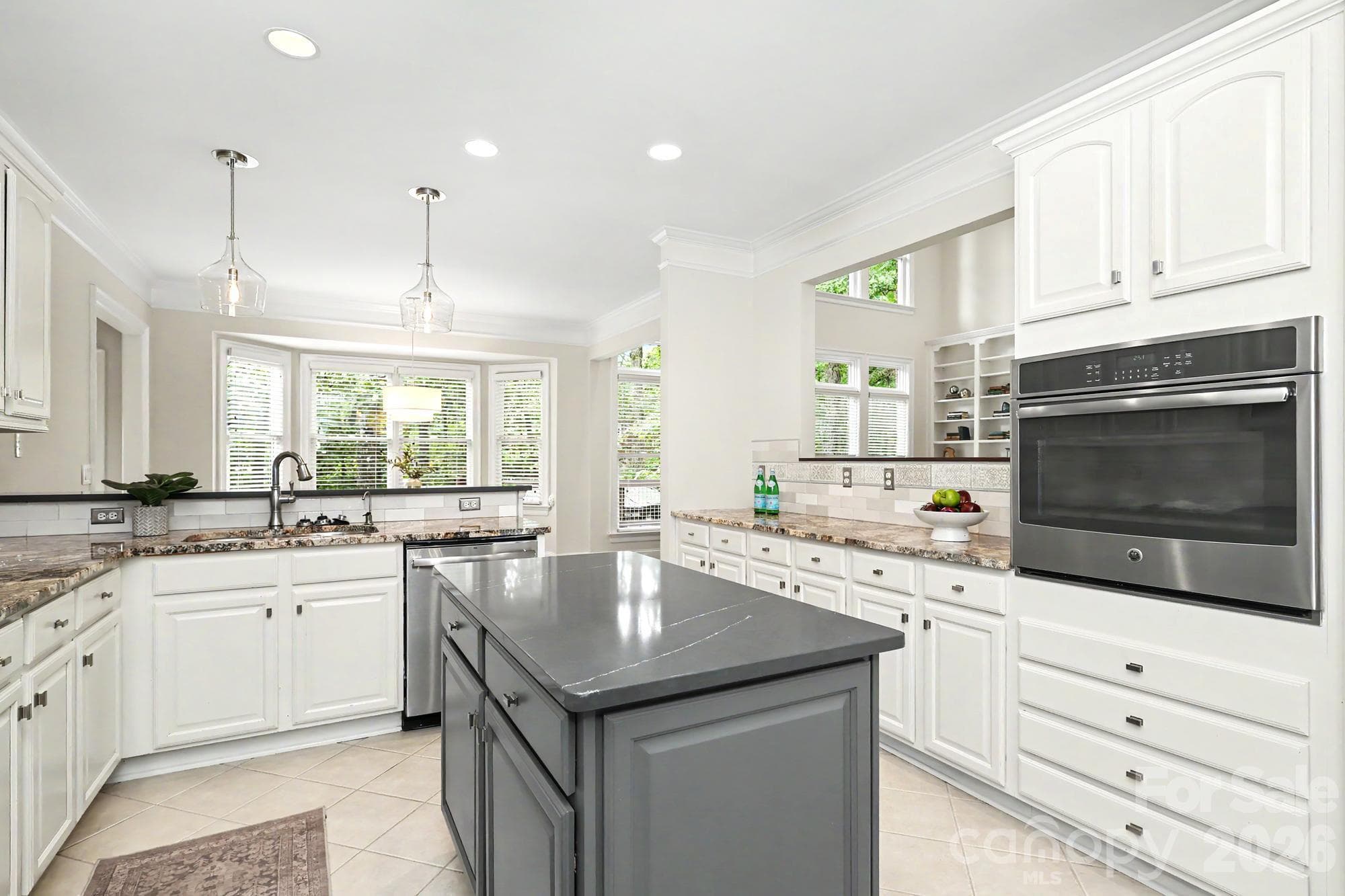 Lovely kitchen with updated lighting, stainless appliances and modern finishes - 4320 Town And Country Drive, Charlotte