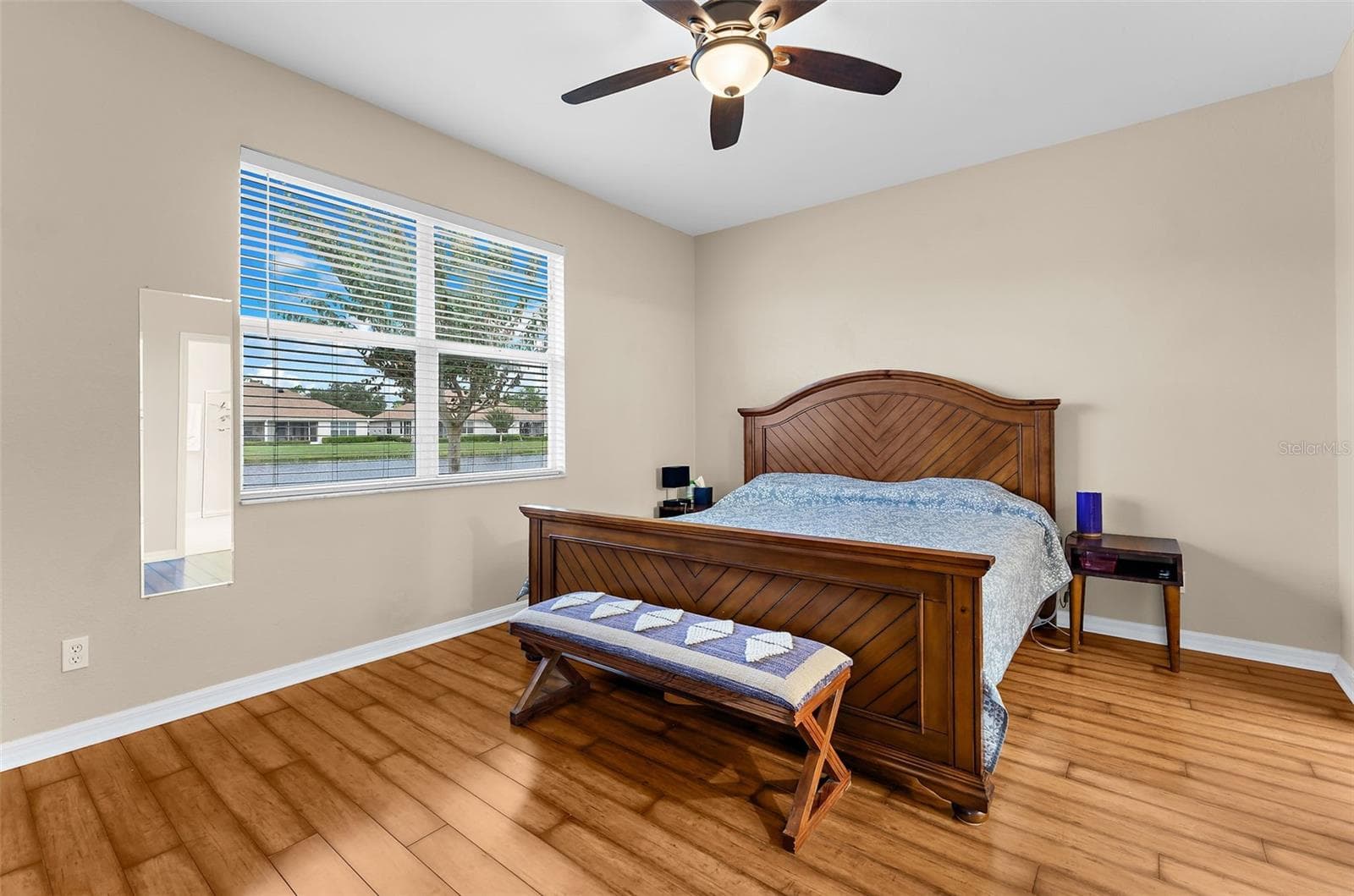 Primary bedroom with lake view - 2491 COTTONWOOD LN, NORTH PORT