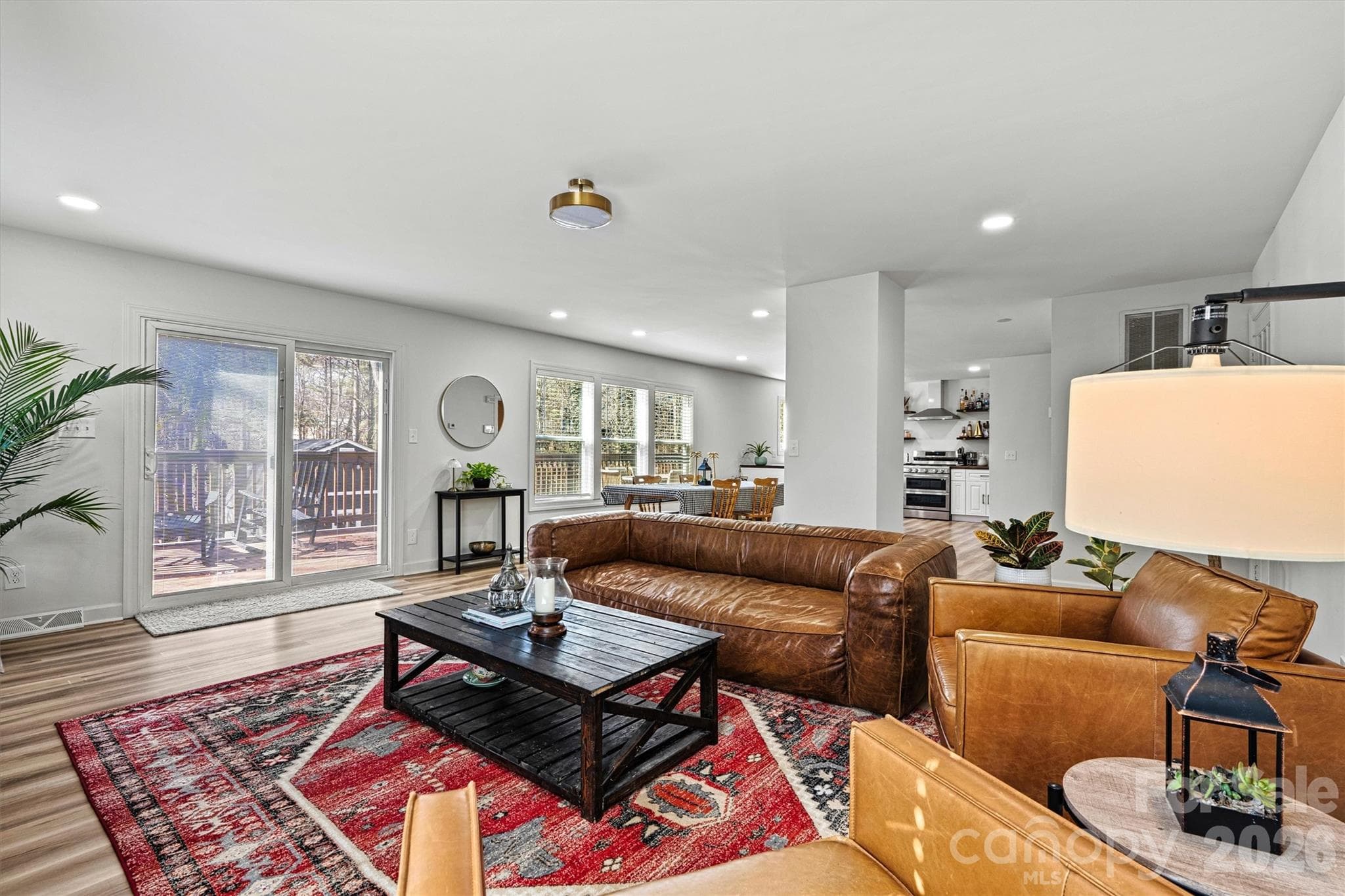 Back sliders lead to a large deck overlooking the backyward. Perfect for entertaining and grilling - 3995 Burton Lane, Denver