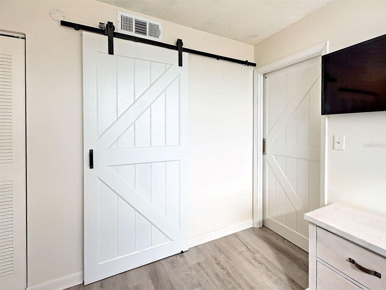 BARN DOORS FOR PRIMARY BEDROOM - 3006 CARING WAY #310, PORT CHARLOTTE