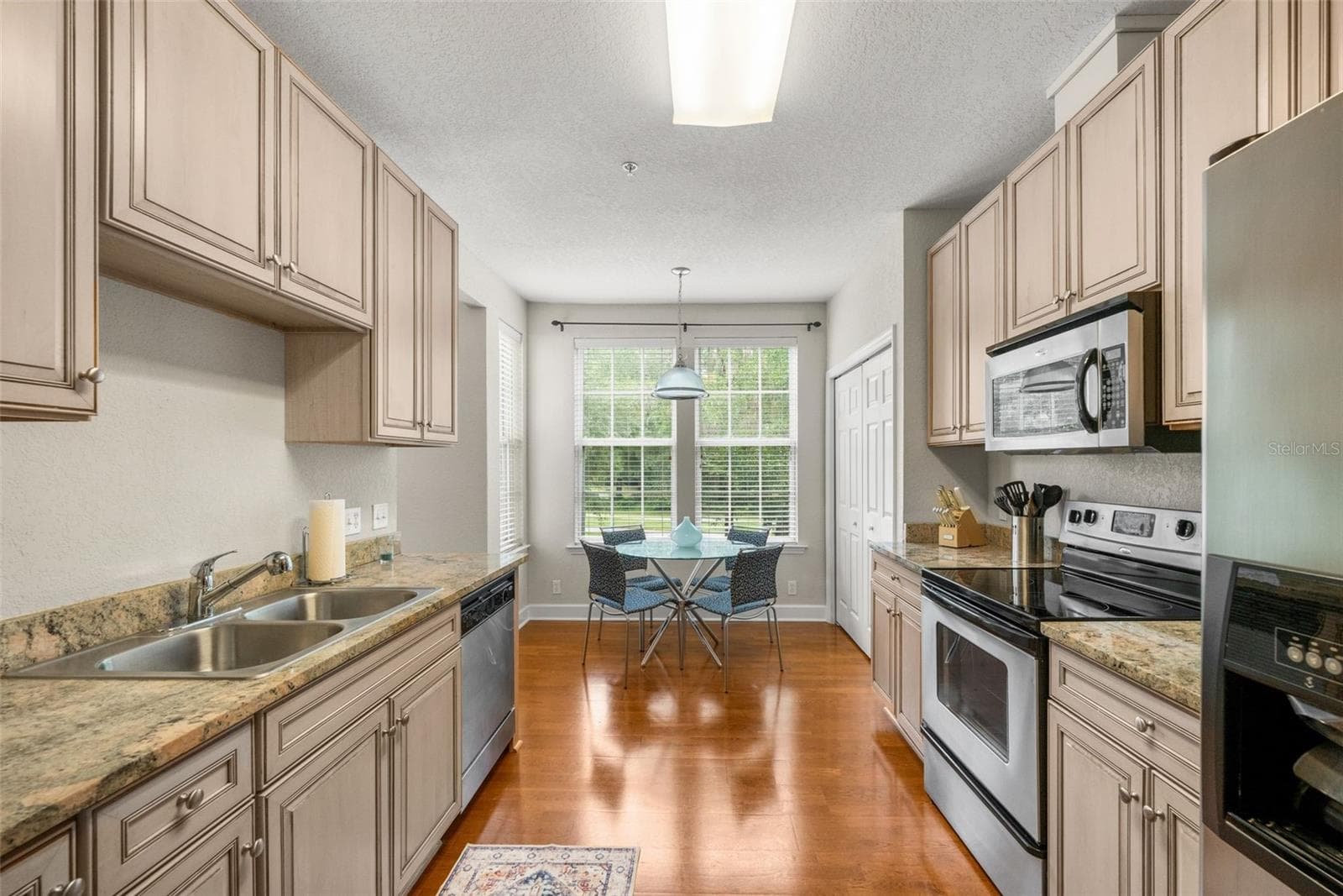 Kitchen with dining area - 4715 SW 91ST DR #201, GAINESVILLE