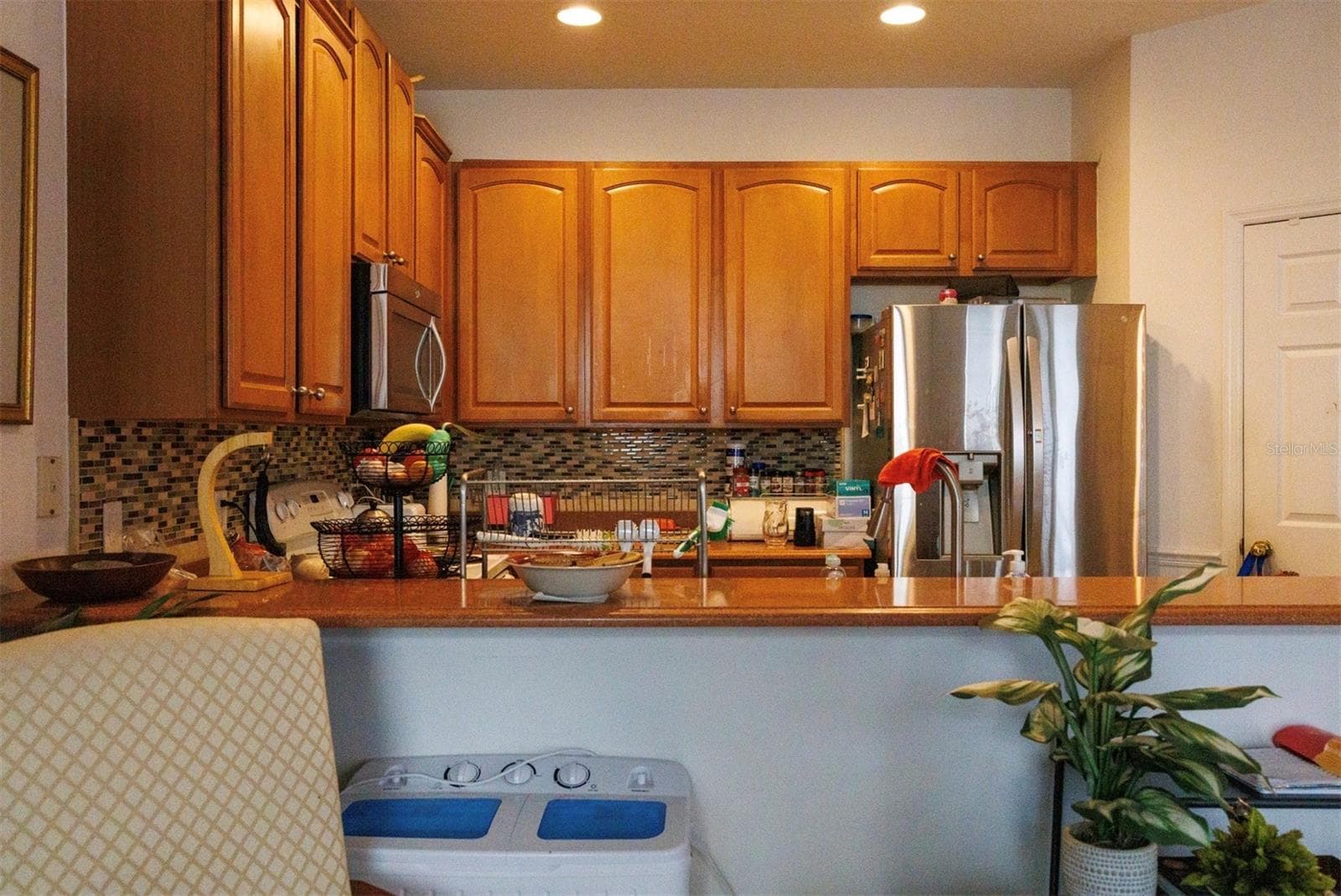 Kitchen with pantry - 1128 TRAVERTINE TER, SANFORD