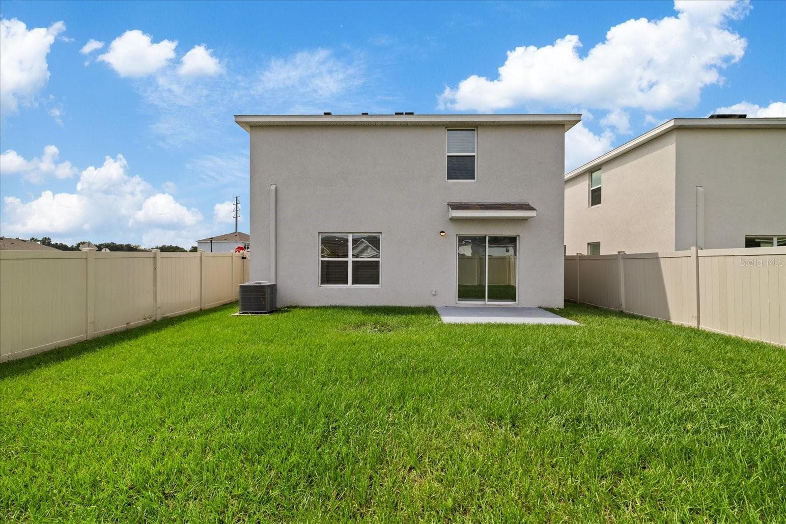 back of the house - 4568 SAND DOLLAR WAY, ZEPHYRHILLS