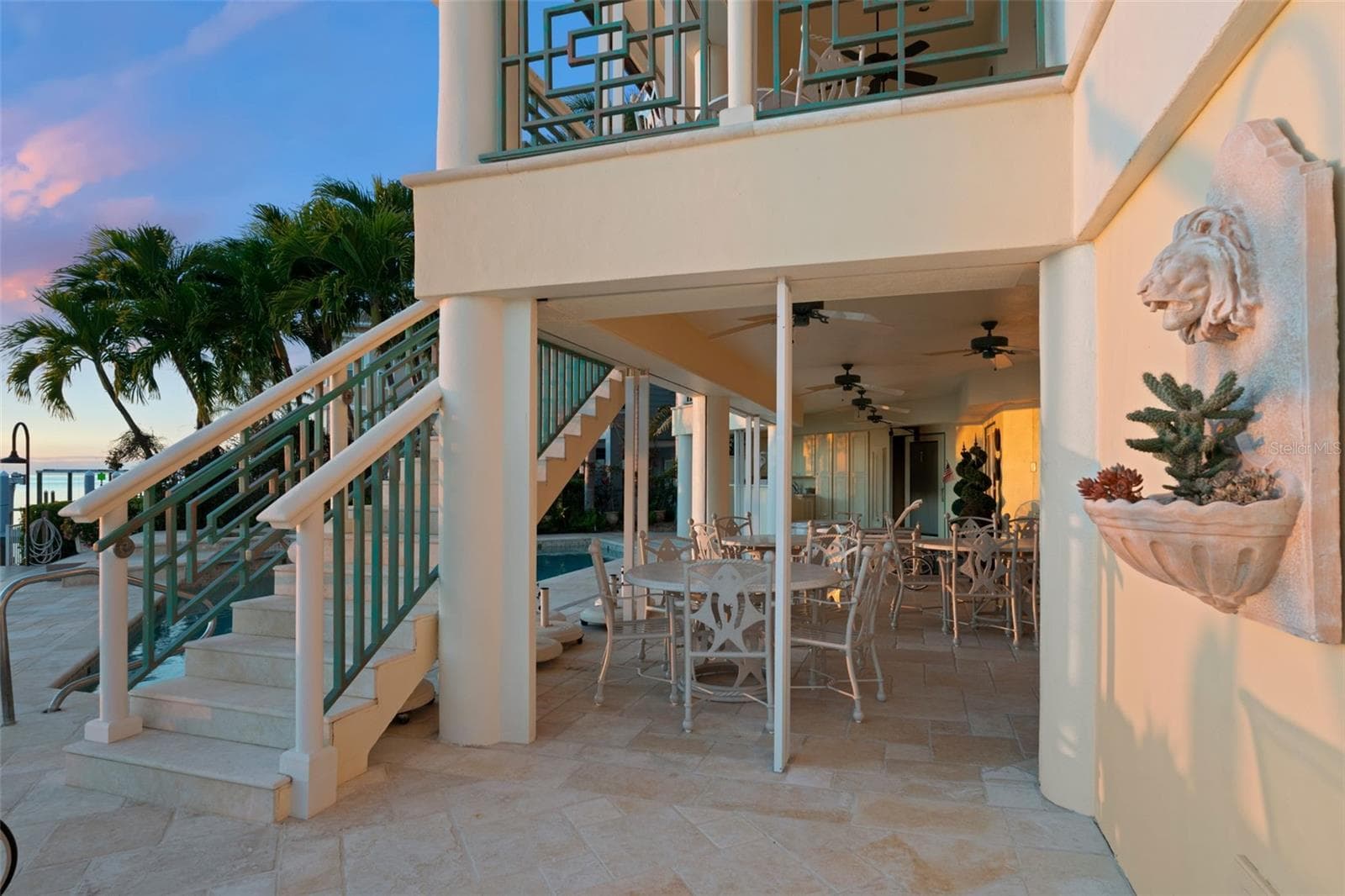 Stairs from the Main Living Level to the Pool and Dock - 964 MONTE CRISTO BLVD, TIERRA VERDE