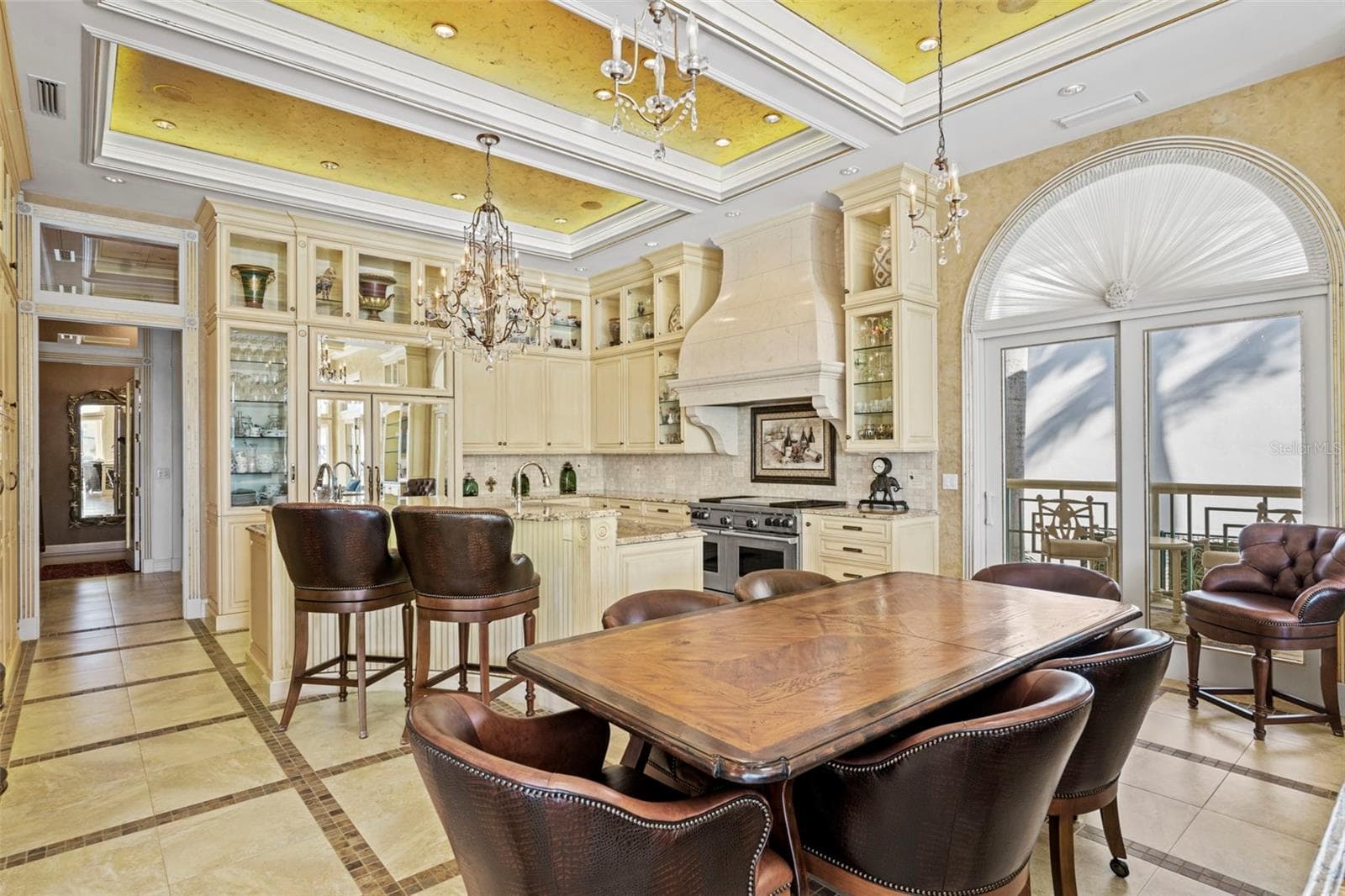 Dining Area in the Great Room with Doors to the Grilling Porch - 964 MONTE CRISTO BLVD, TIERRA VERDE
