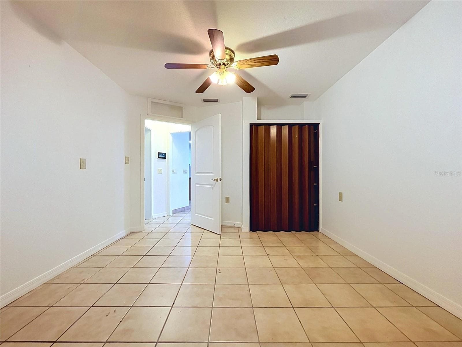 Bonus room with tile flooring and ceiling fan - 1348 EDGEWATER BEACH DR, LAKELAND