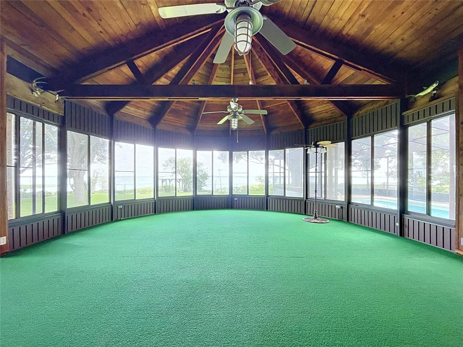 Lanai with large windows and vaulted wood ceiling - 1348 EDGEWATER BEACH DR, LAKELAND