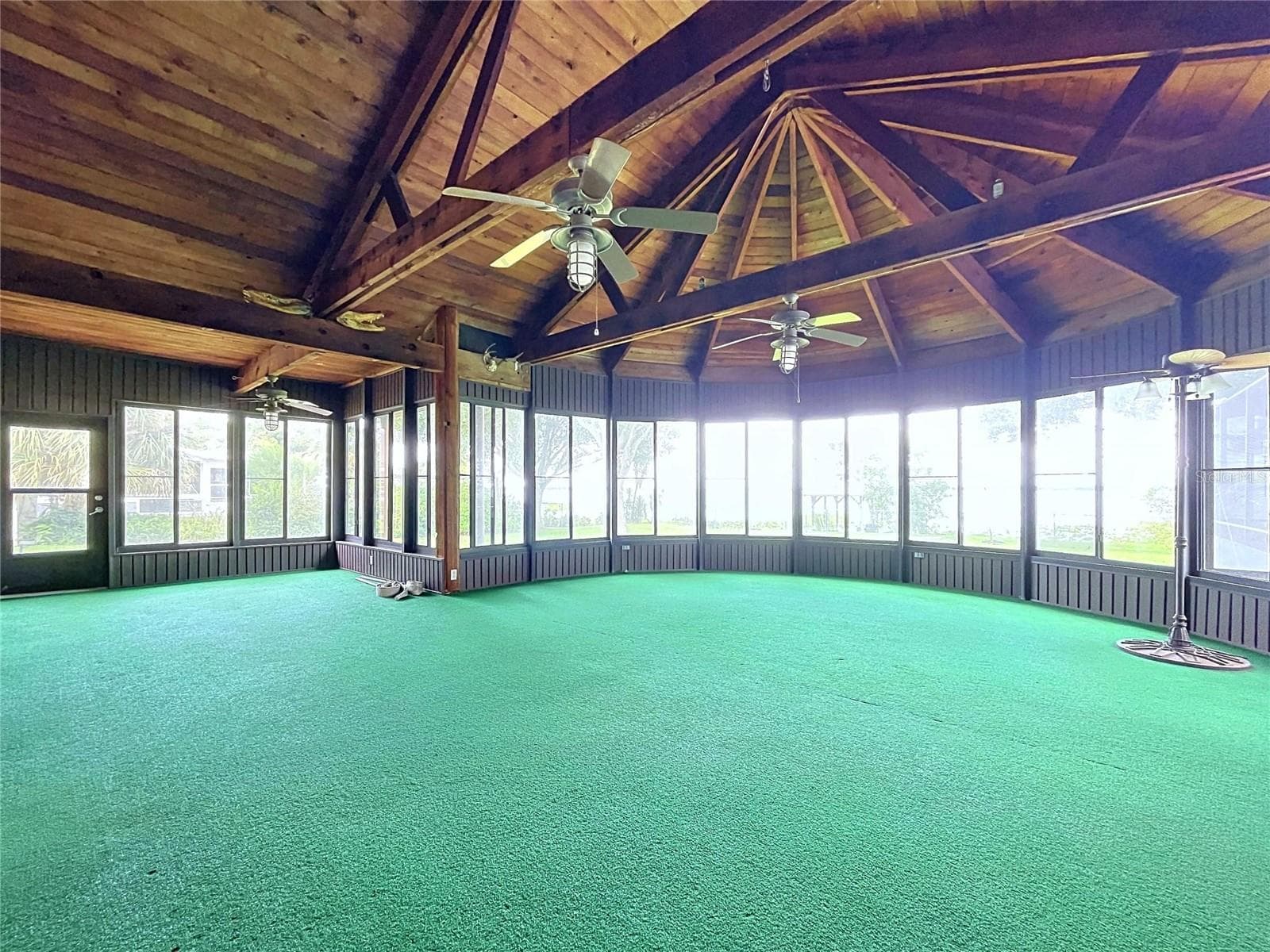 Lanai with large windows and vaulted wood ceiling - 1348 EDGEWATER BEACH DR, LAKELAND