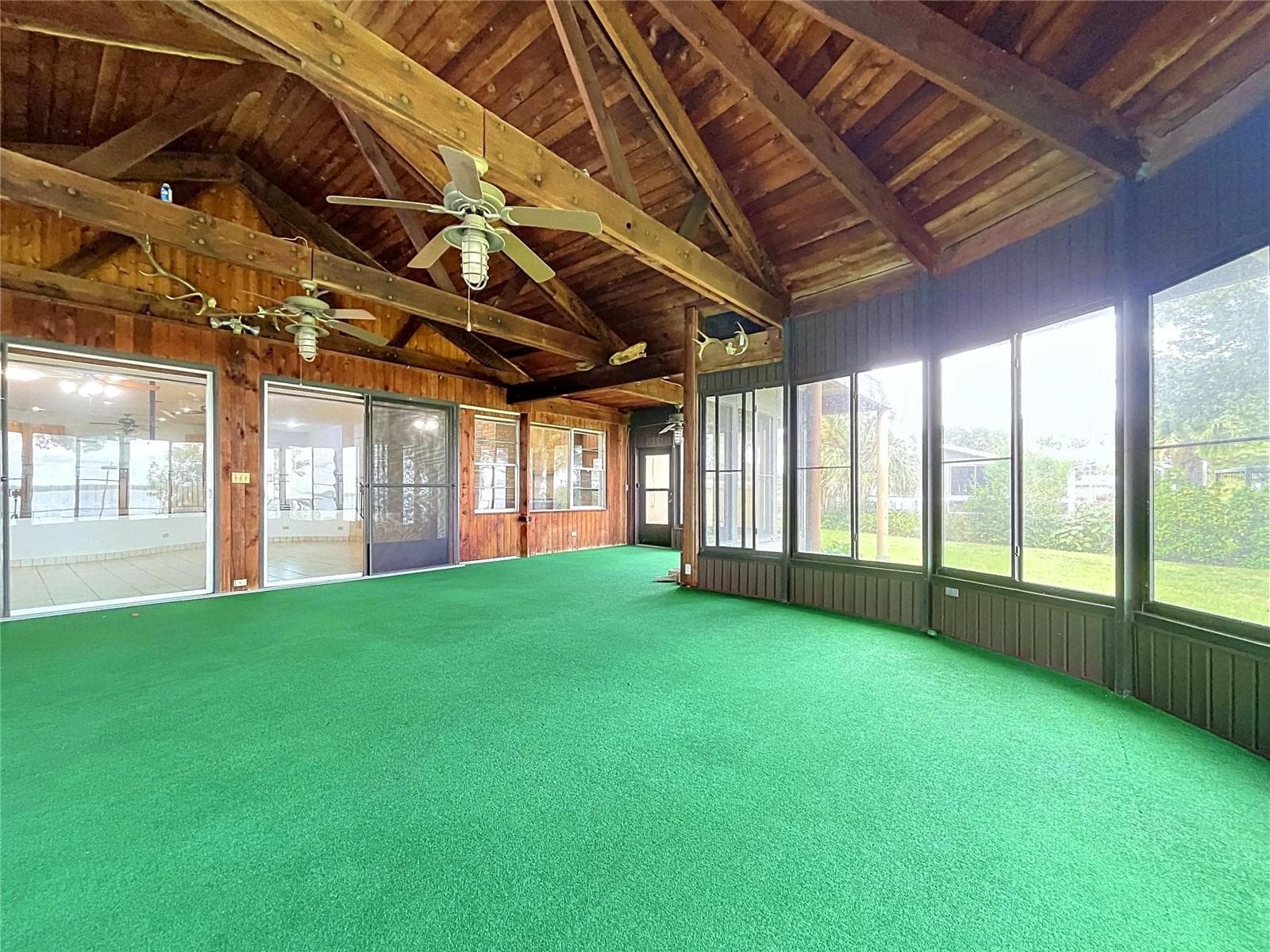 Lanai with large windows and vaulted wood ceiling - 1348 EDGEWATER BEACH DR, LAKELAND