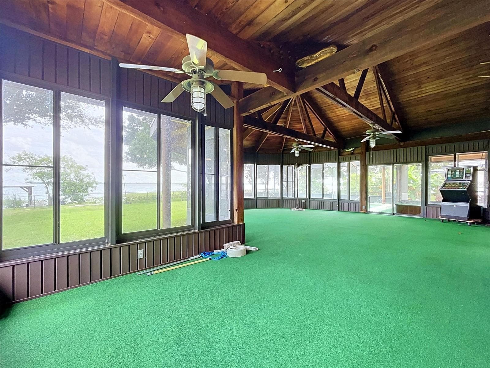 Lanai with large windows and vaulted wood ceiling - 1348 EDGEWATER BEACH DR, LAKELAND
