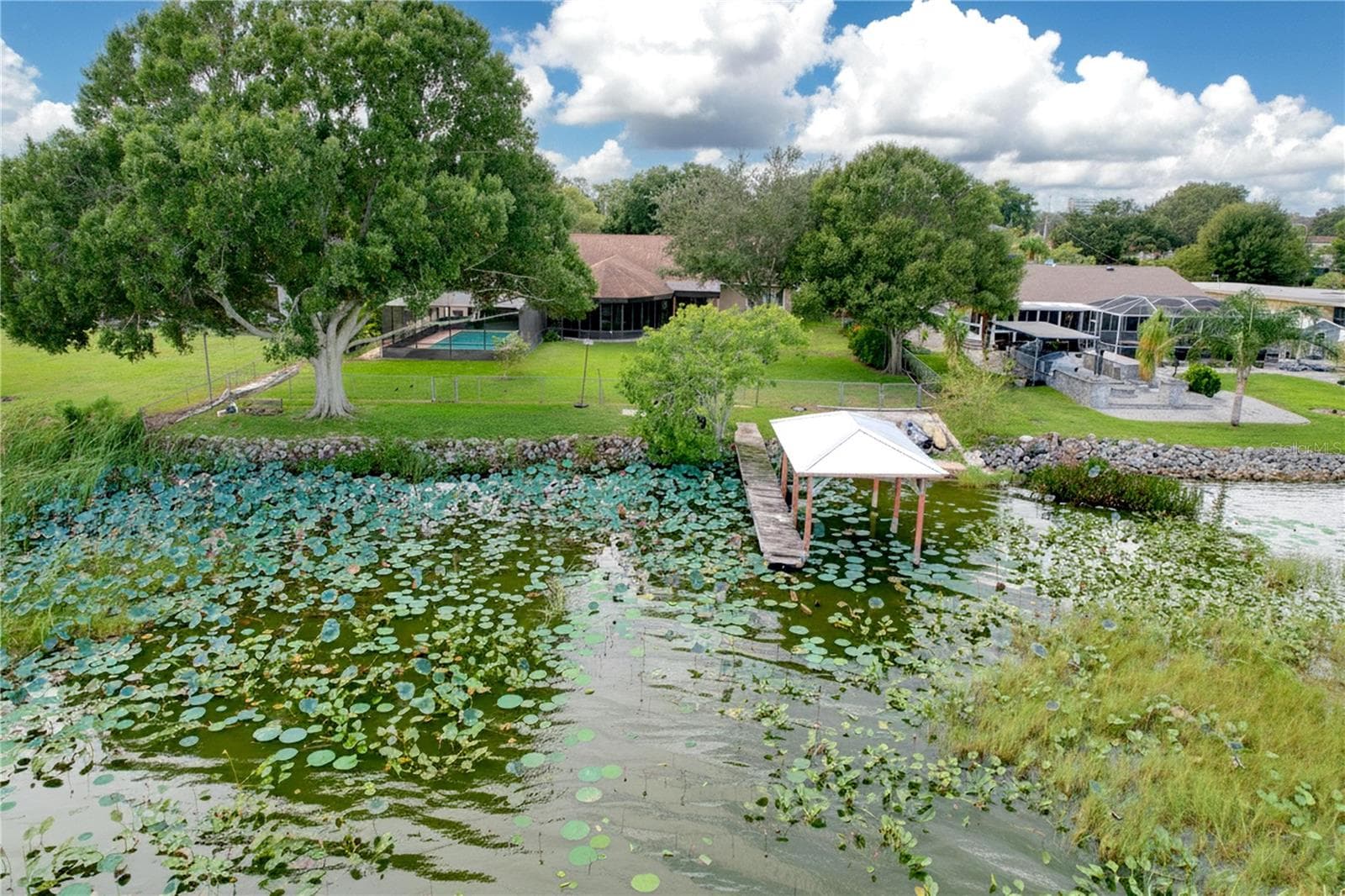 Aerial view from water of backyard, dock, and ramp - 1348 EDGEWATER BEACH DR, LAKELAND
