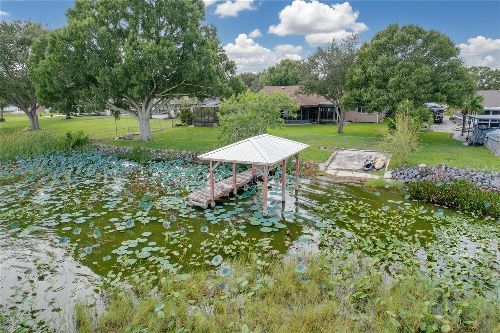 Aerial view from water of backyard, dock, and ramp - 1348 EDGEWATER BEACH DR, LAKELAND