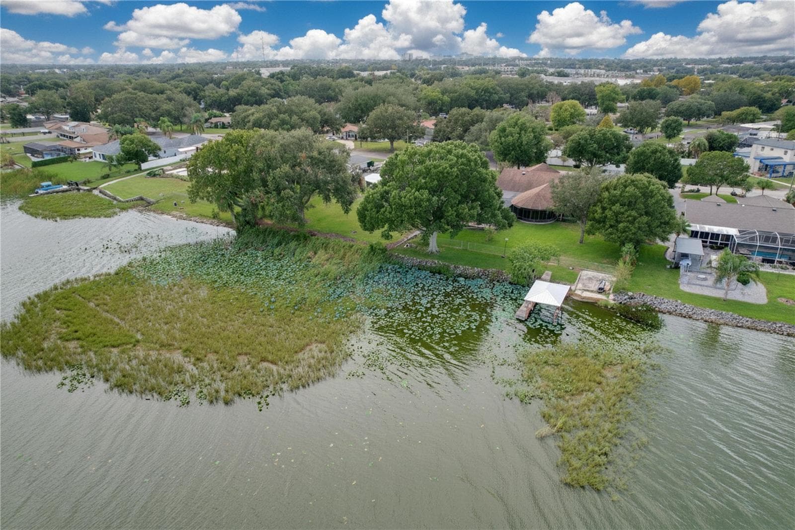Aerial view from water of backyard, dock, and ramp - 1348 EDGEWATER BEACH DR, LAKELAND