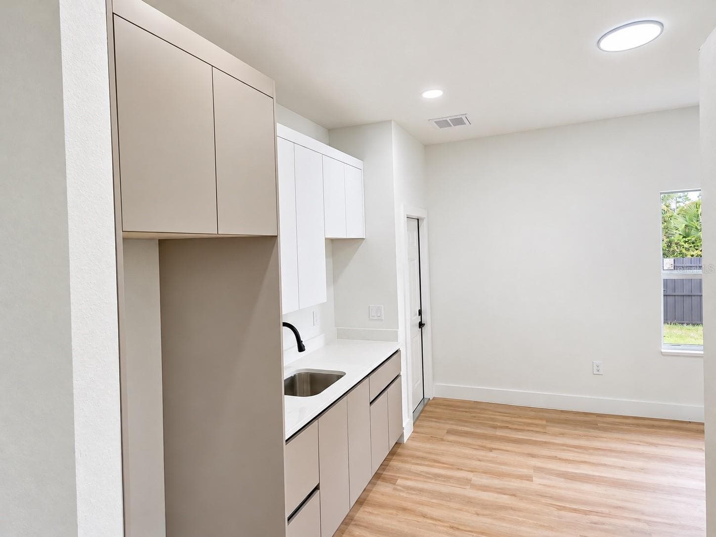 Private in-law suite featuring a kitchenette and flexible living space. - 3126 BELLEVILLE TER, NORTH PORT