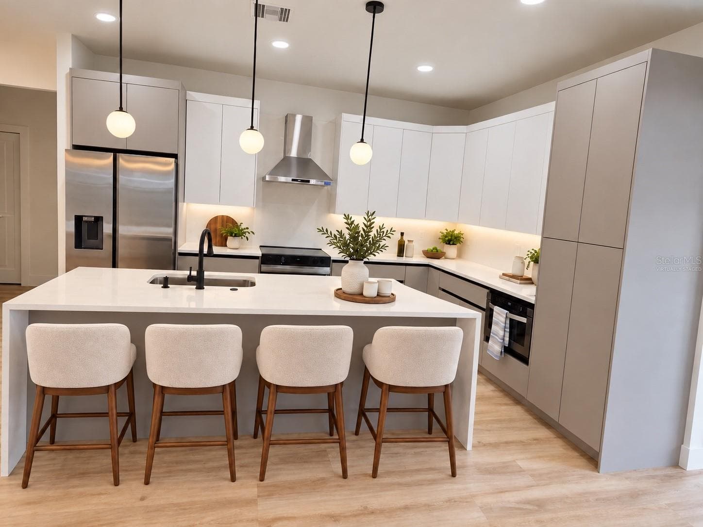 Virtually staged kitchen featuring an island with seating for four. - 3126 BELLEVILLE TER, NORTH PORT