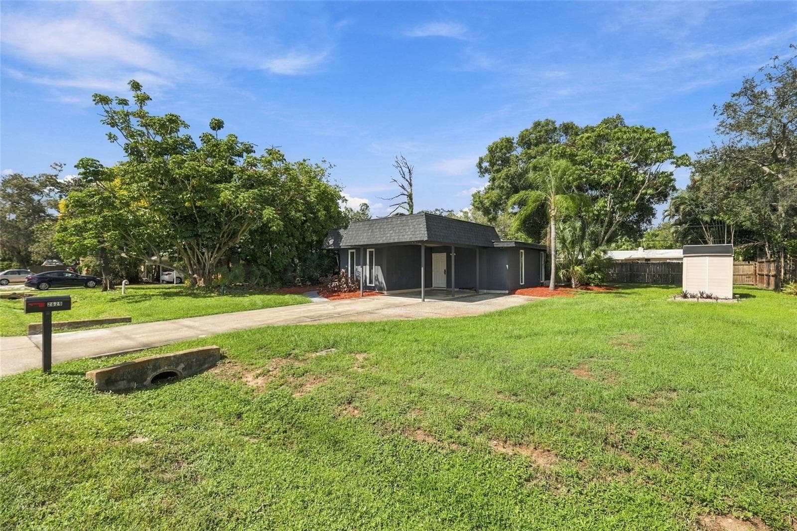 Front Exterior with covered carport and large yard - 2629 JAMAICA ST #1, SARASOTA