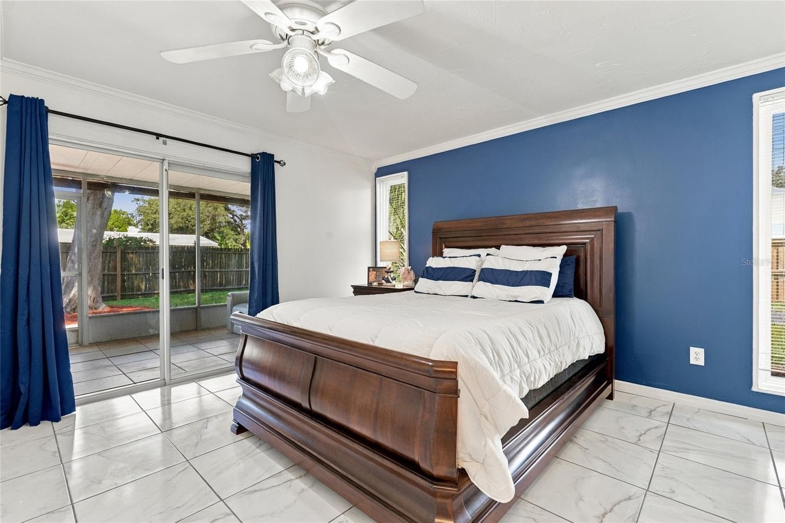 Spacious Primary Bedroom with Direct Access to the Screened-In Lanai - 2629 JAMAICA ST #1, SARASOTA
