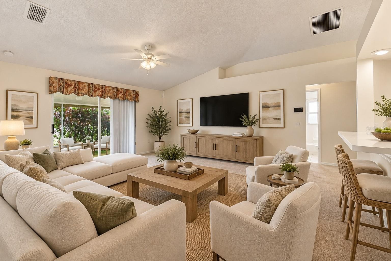 Virtually staged family room  vaulted ceilings - 610 LAKEMONT DR, BRANDON