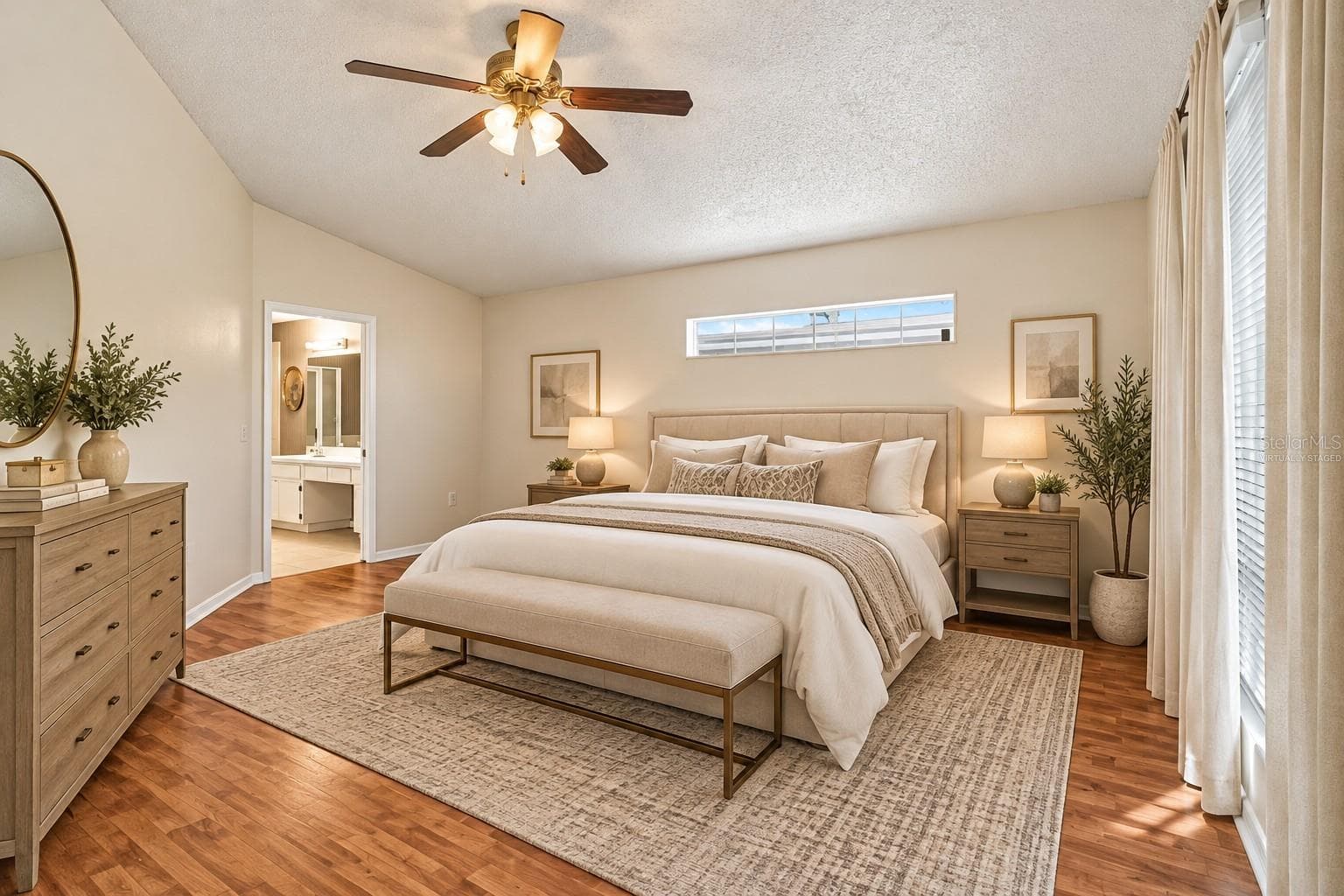 Virtually staged Primary bedroom laminate flooring - 610 LAKEMONT DR, BRANDON