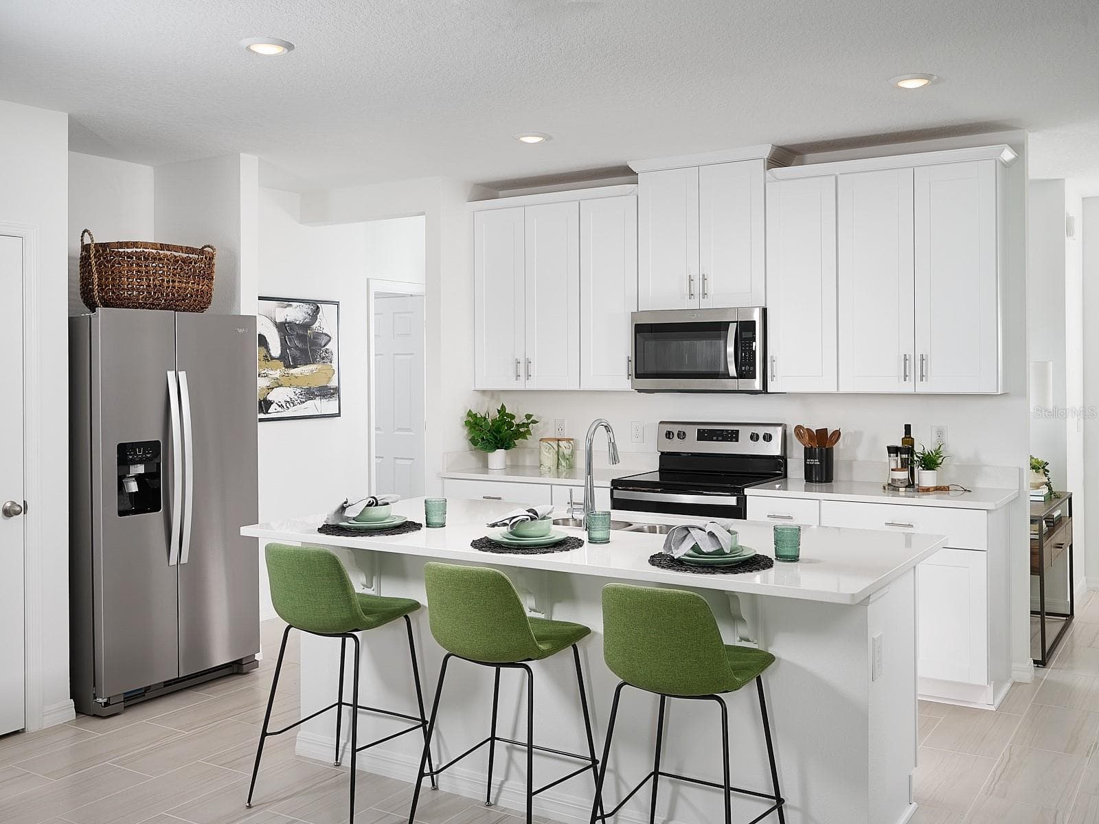 Photo is not of the actual home, but is an inspirational photo of builder’s model home and may depict options, furnishings, and/or decorator features that are not included. - 3935 TEAK LN, BARTOW