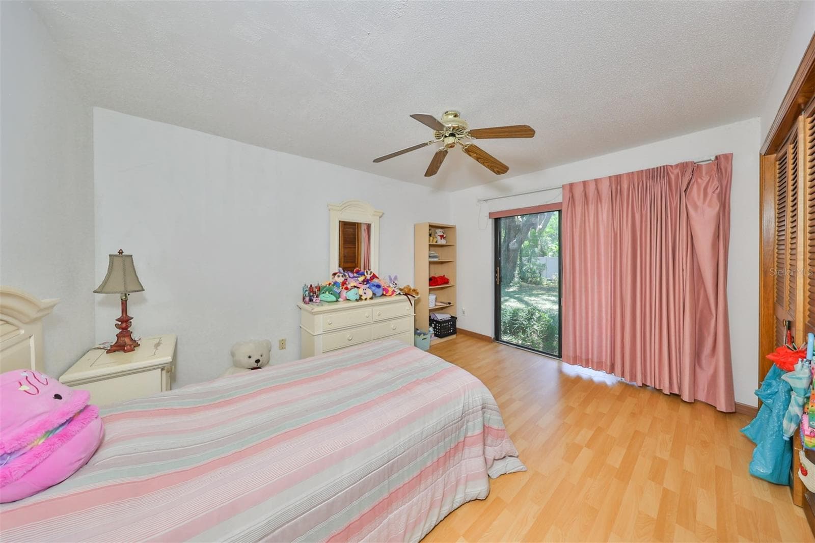 Bedroom #4 is good size and bright with the sliding glass doors - 2609 MANOR OAK DR, VALRICO