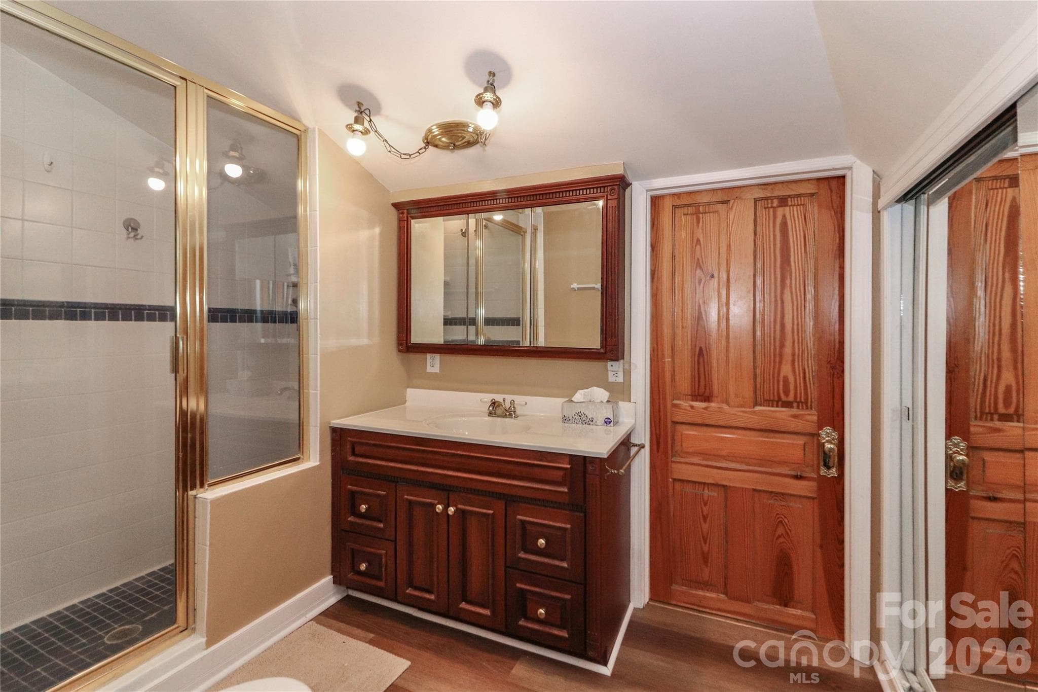 Primary Bath with adjacent laundry room and walk-in attic space/storage - 235 Walnut Street, Statesville
