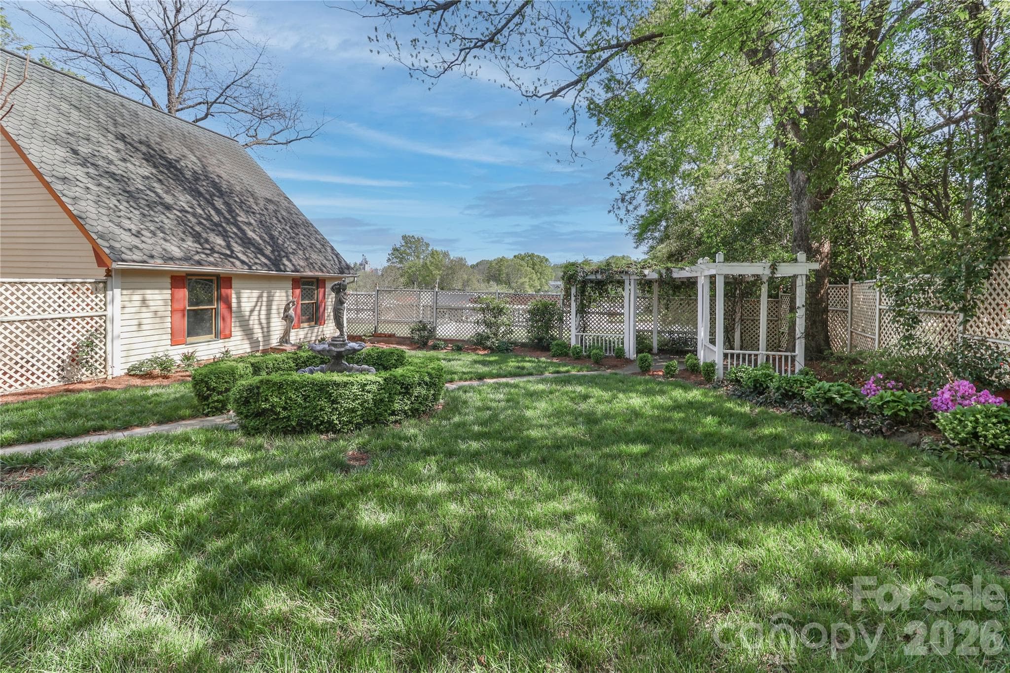Arbor in the backyard with sitting area. - 235 Walnut Street, Statesville