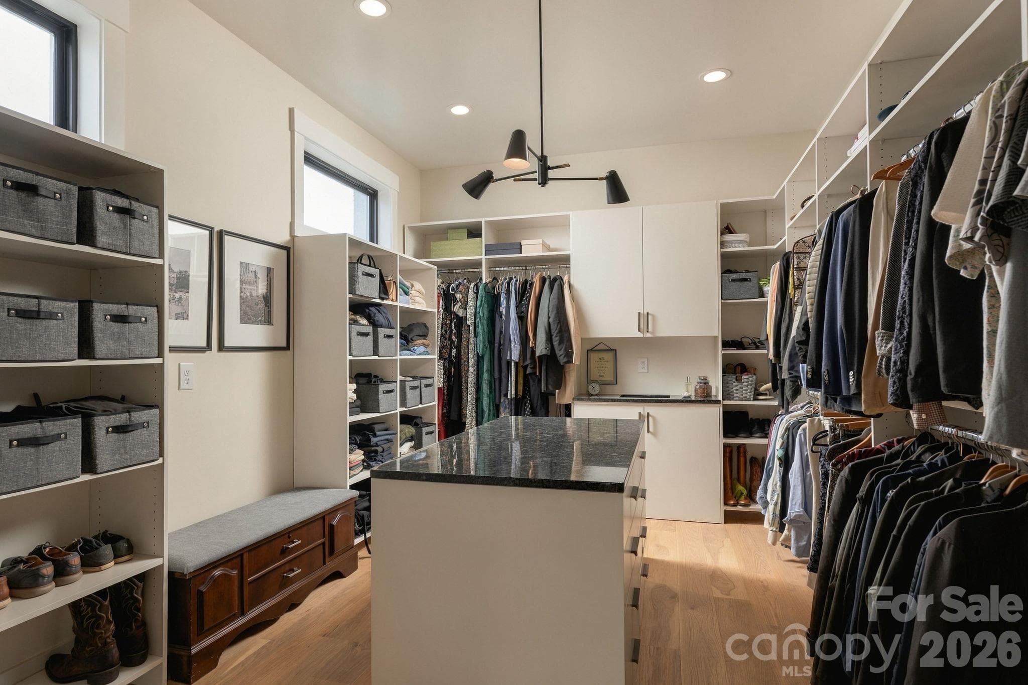 Primary Bedroom Closet with  extensive built ins and pass through for laundry - 298 Marietta Road, Mooresville