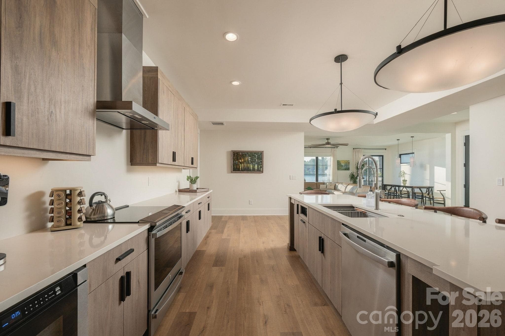 Lower level kitchen looking towards living room with views of the lake - 298 Marietta Road, Mooresville