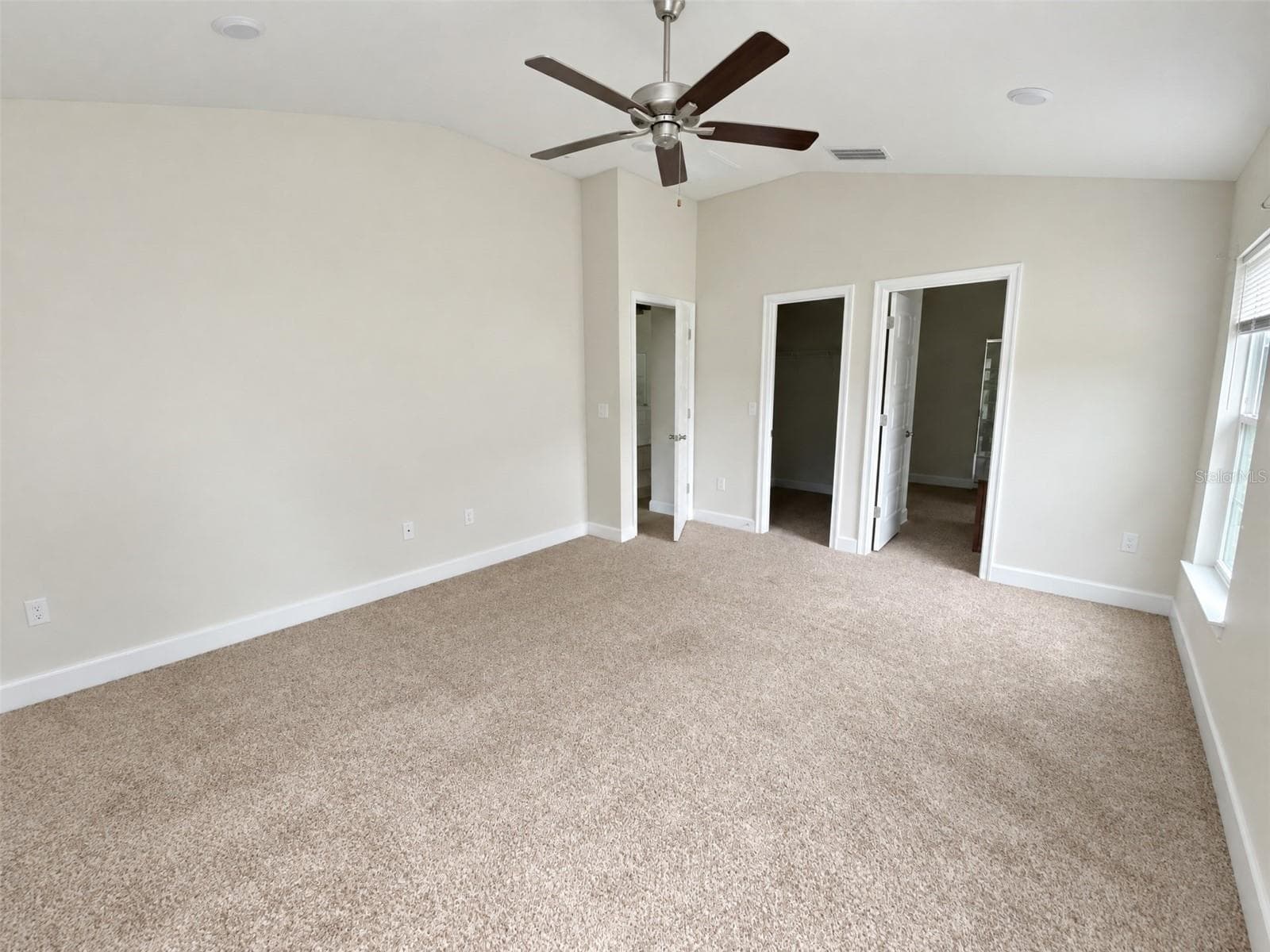 Primary Bed Room. View towards En-suite and Walk-In Closet - 2091 PECOS DR, POINCIANA