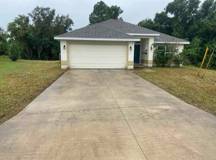 Front View of Home After Grass Cutting. - 2091 PECOS DR, POINCIANA