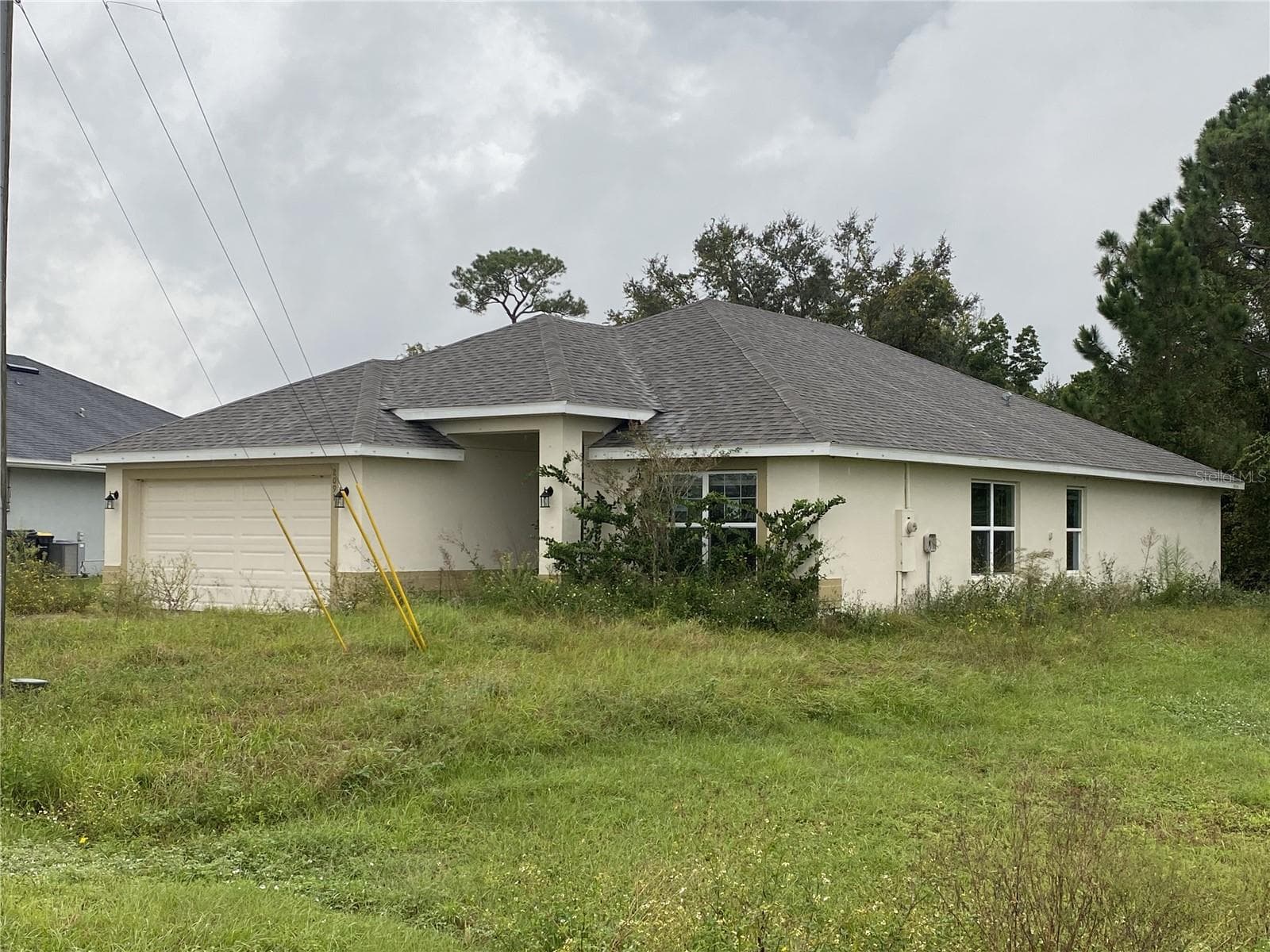 View of Backyard Prior to Grass Cutting - 2091 PECOS DR, POINCIANA