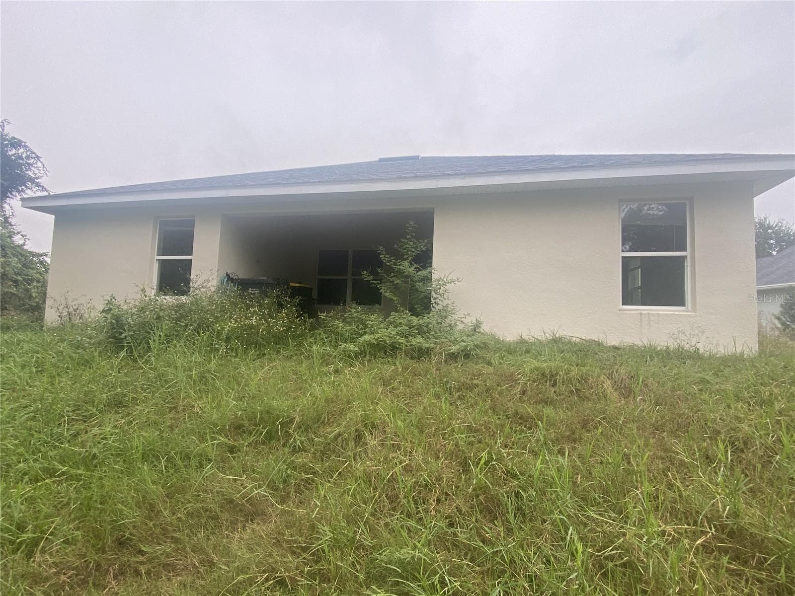 Back Yard Prior to Grass Cutting. - 2091 PECOS DR, POINCIANA