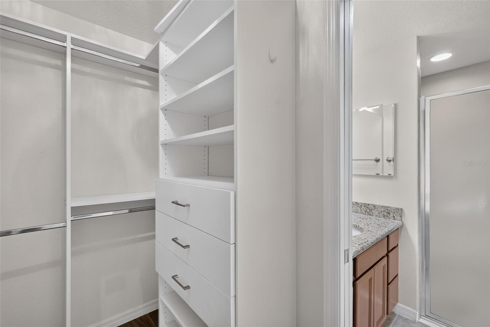 Primary Bedroom Customized Walk-In Closet - 3056 EASTWOOD TER, THE VILLAGES