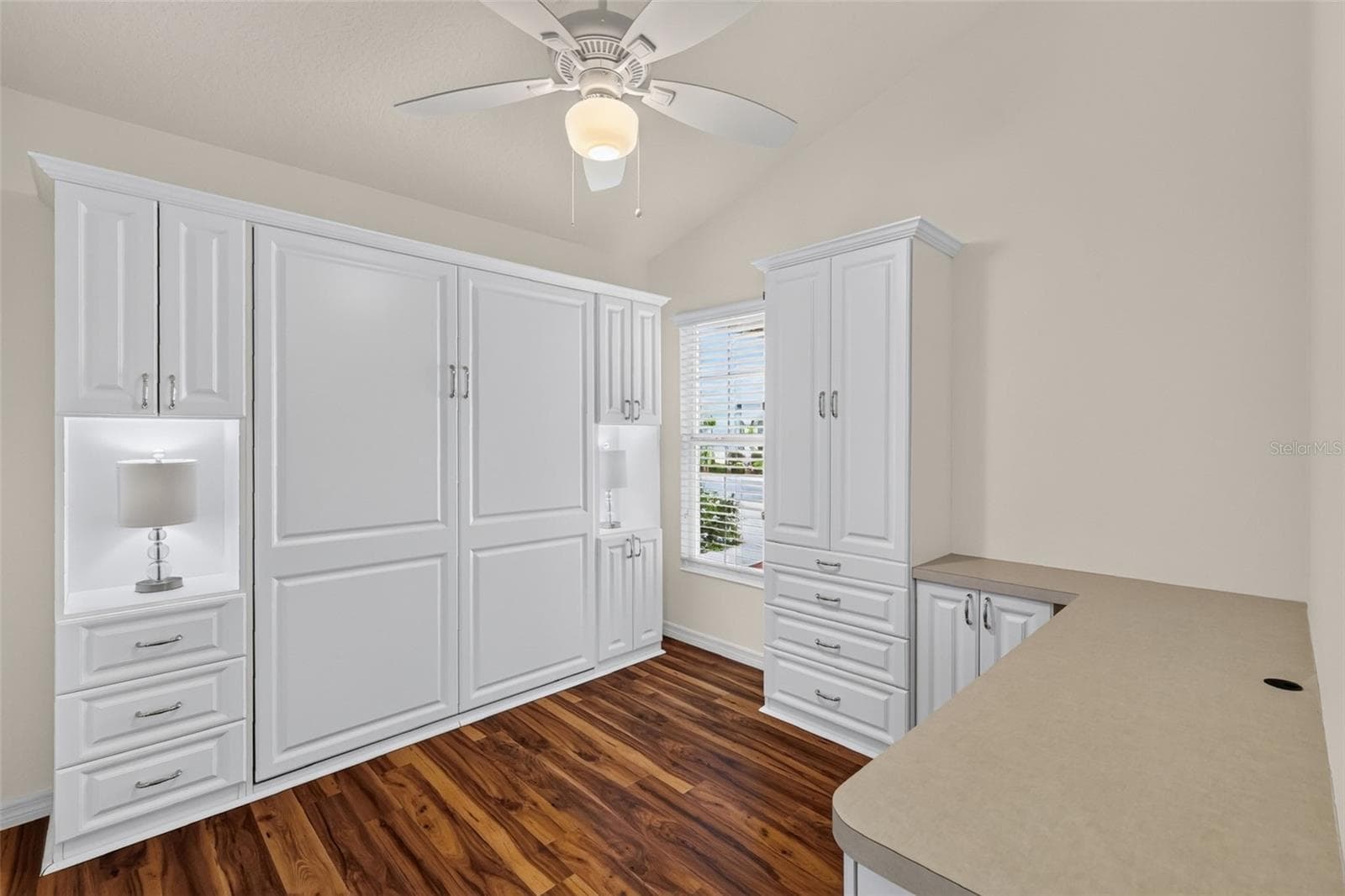 Second Bedroom with Murphy Bed, Custom Cabinetry, and Built-In Desk - 3056 EASTWOOD TER, THE VILLAGES