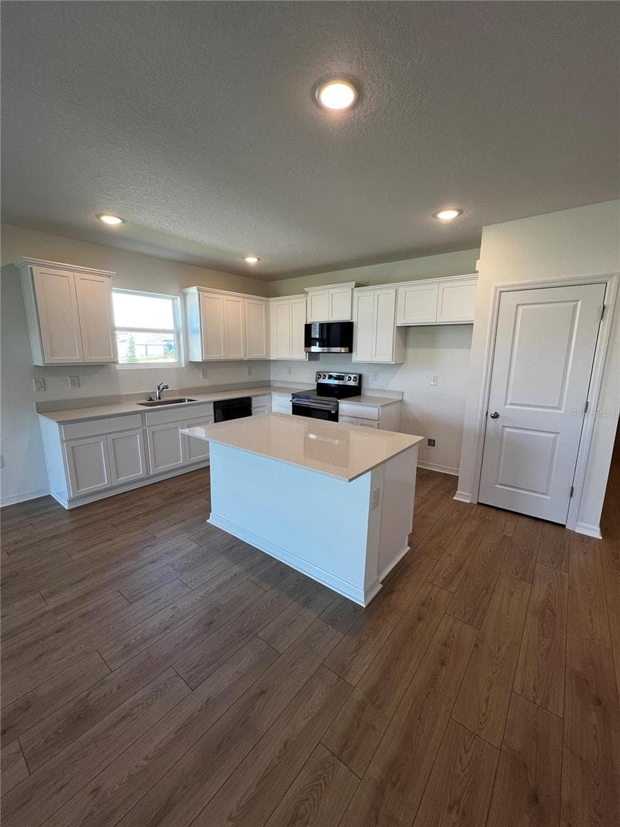 Kitchen with island - 12927 RED DEER PL, PARRISH