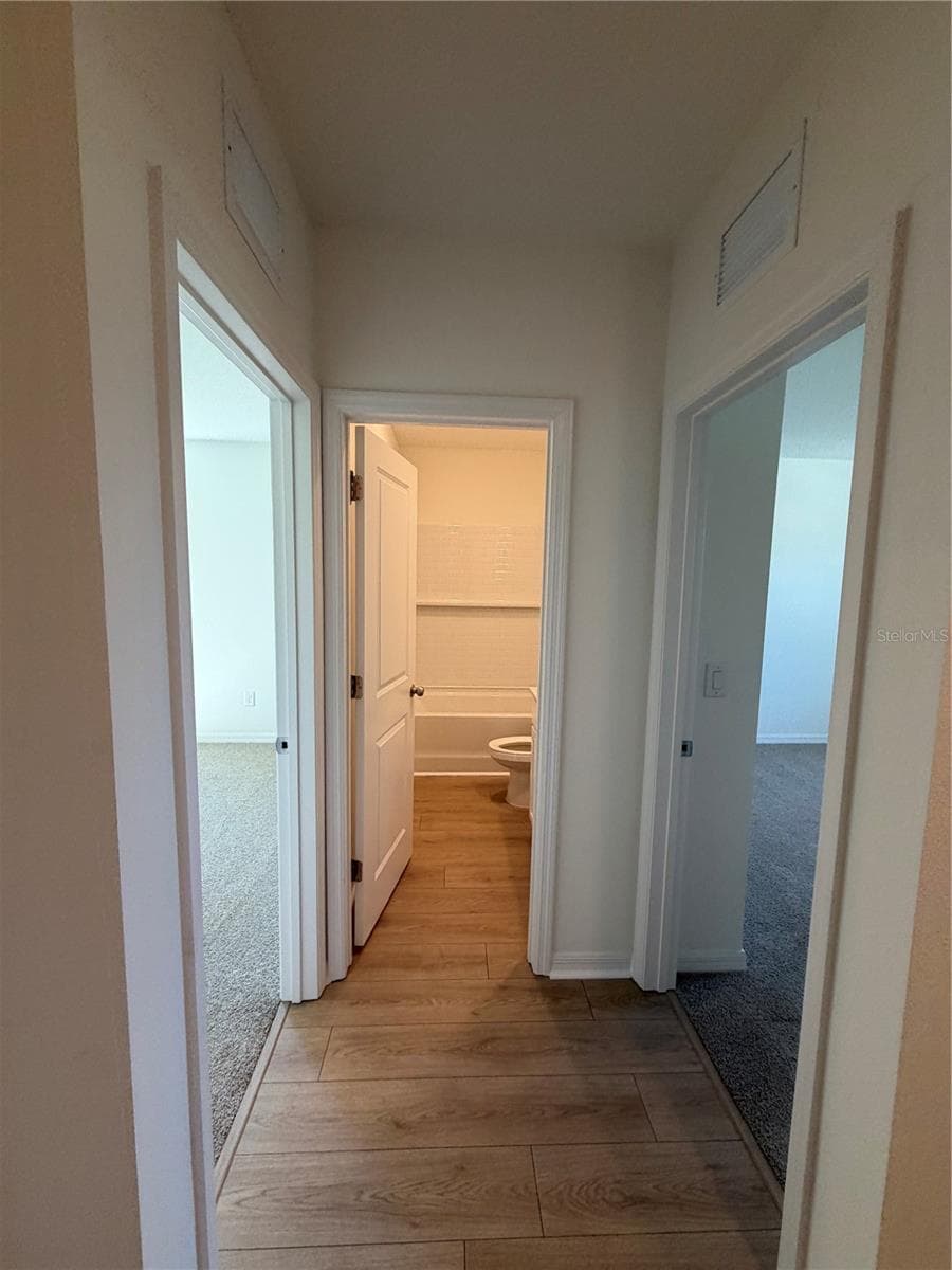 Hallway to guest bedrooms and bath - 12922 RED DEER PL, PARRISH