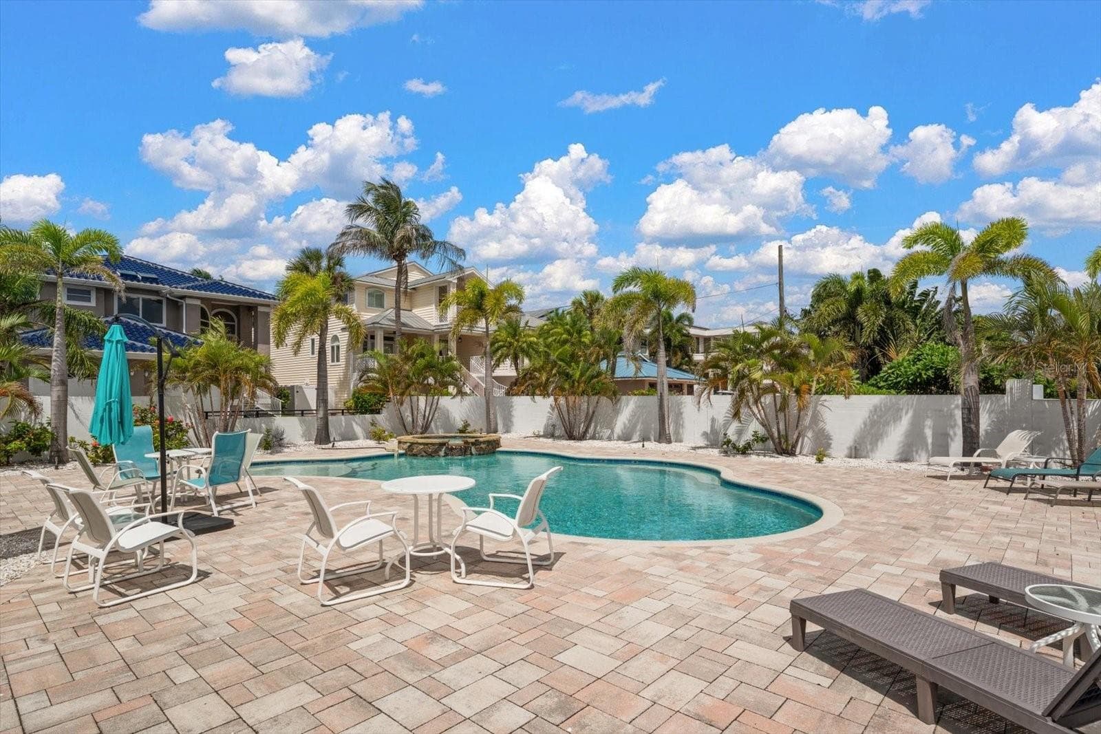 Pool is surrounded by lots of area to relax and enjoy. - 1512 GULF BLVD, INDIAN ROCKS BEACH