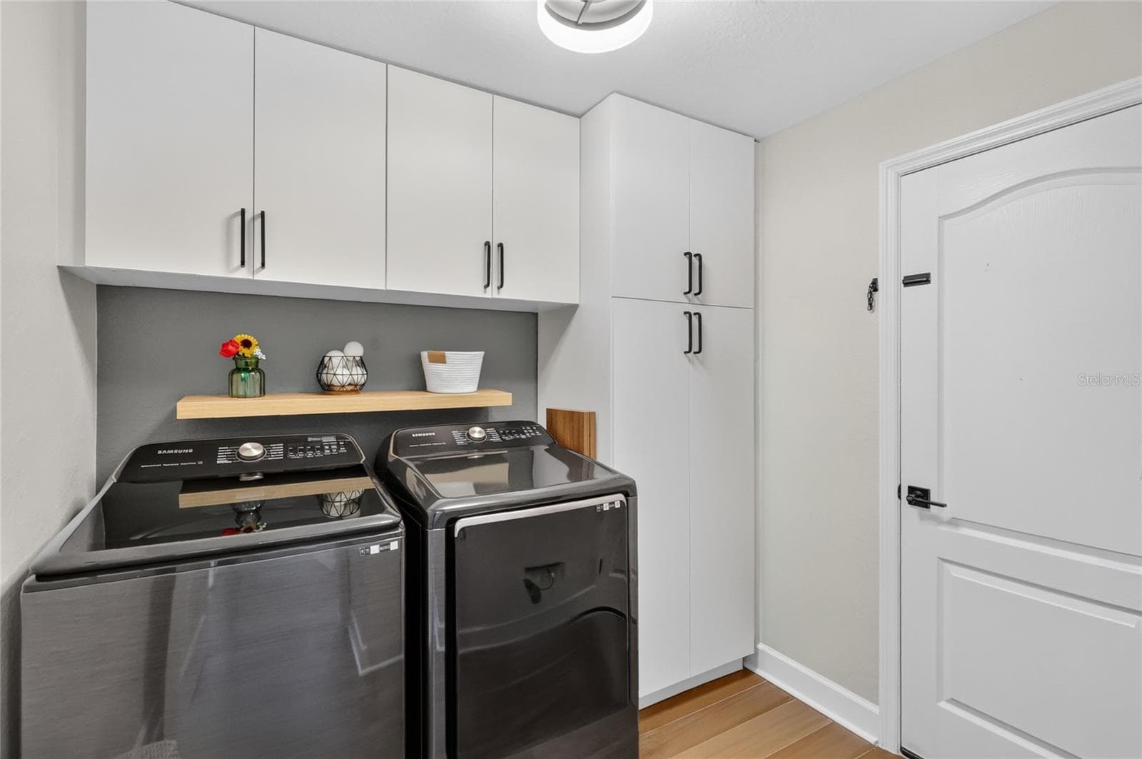 Laundry room with lots of cabinet space the owners added. - 5020 MOSS HAMMOCK TRL, SEBRING