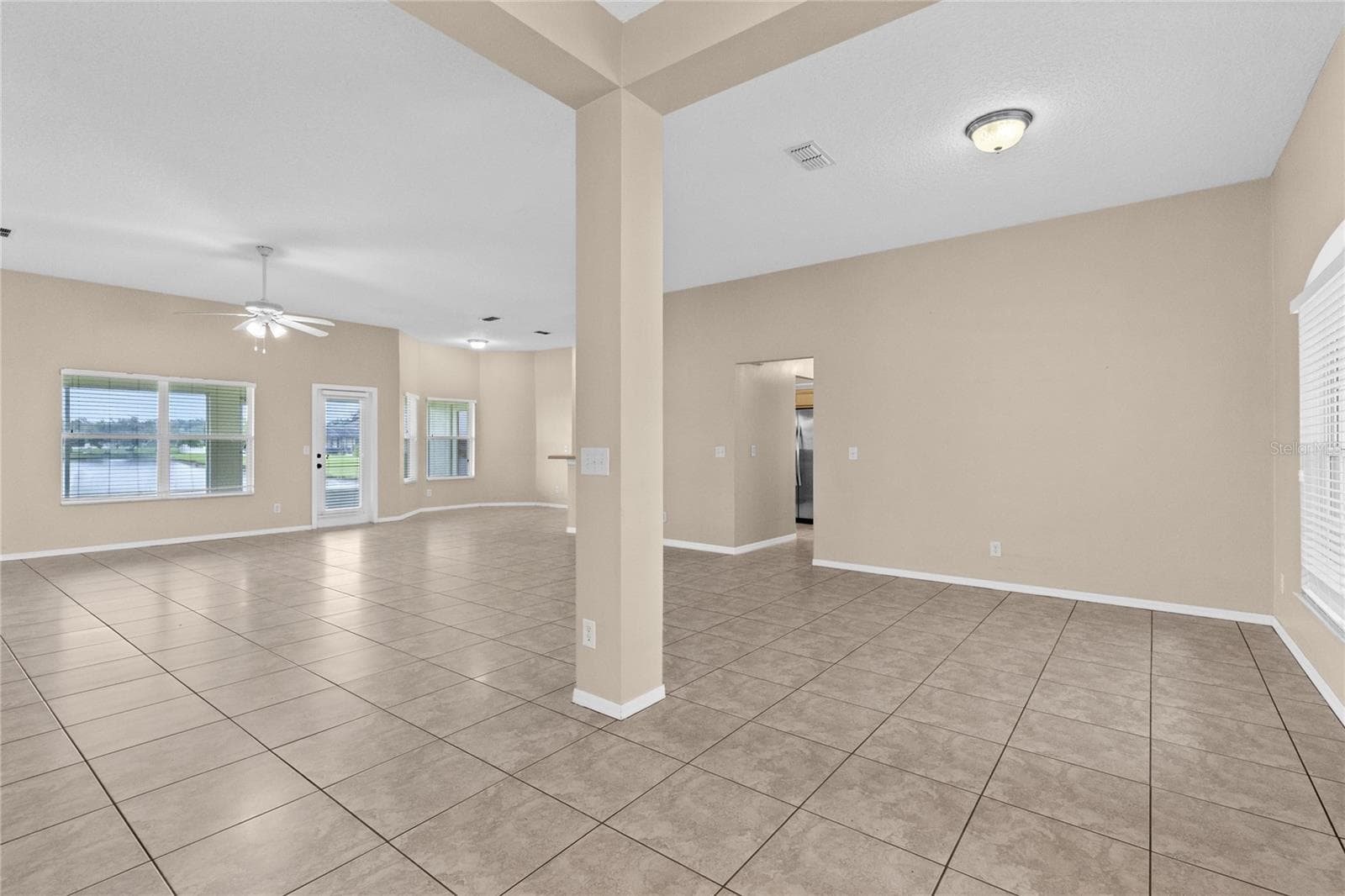 View from front door overlooking Dining area and Living area - 3235 LORIMAR LN, ST CLOUD