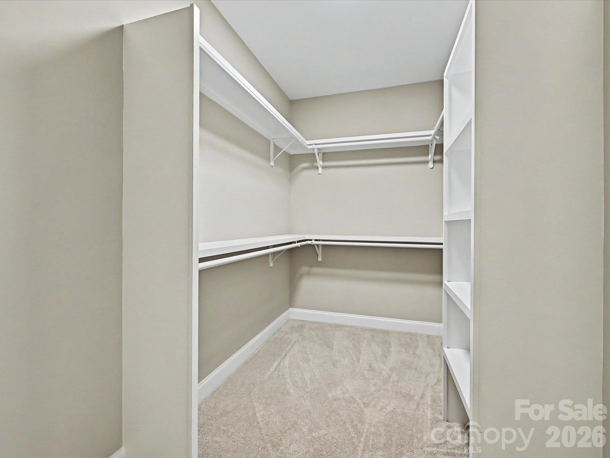 Spacious walk in closet provides abundant storage with built in shelving & convenient dual hanging space. - 159 Lone Pine Road, Statesville