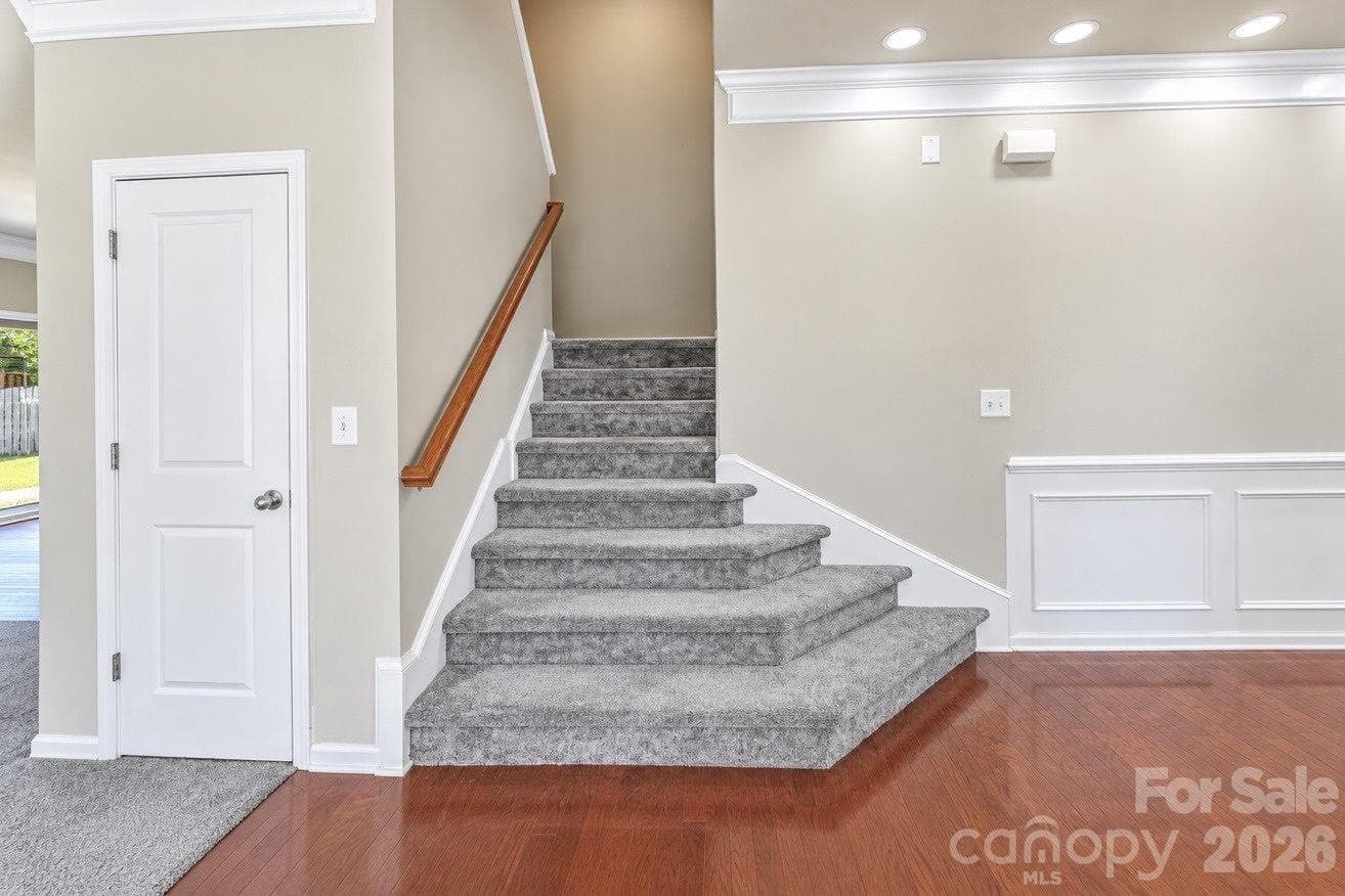 Stairs leading to 2nd floor from main level - 7041 Carnwarth Lane, Indian Land
