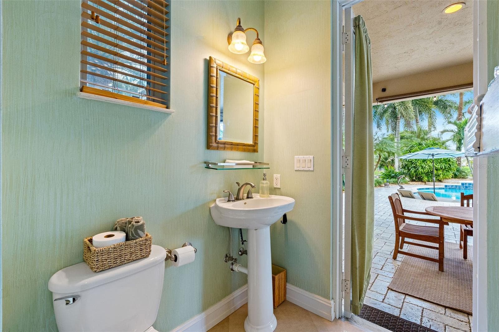 half pool bath with door to patio - 3800 SW 137TH AVE, MIRAMAR