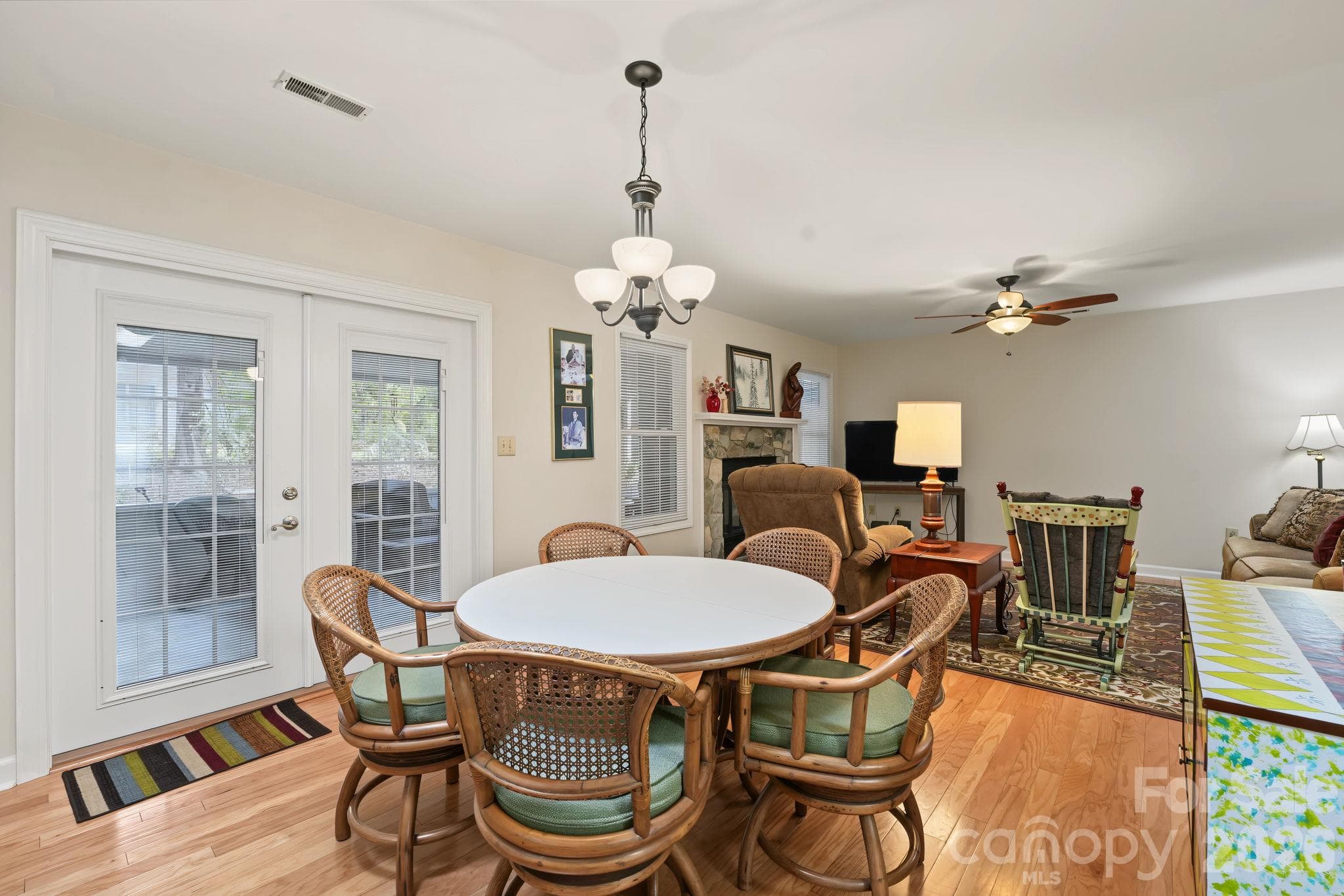 Dining area with view into living room and screened porch - 420 English Ivy Court, Fort Mill
